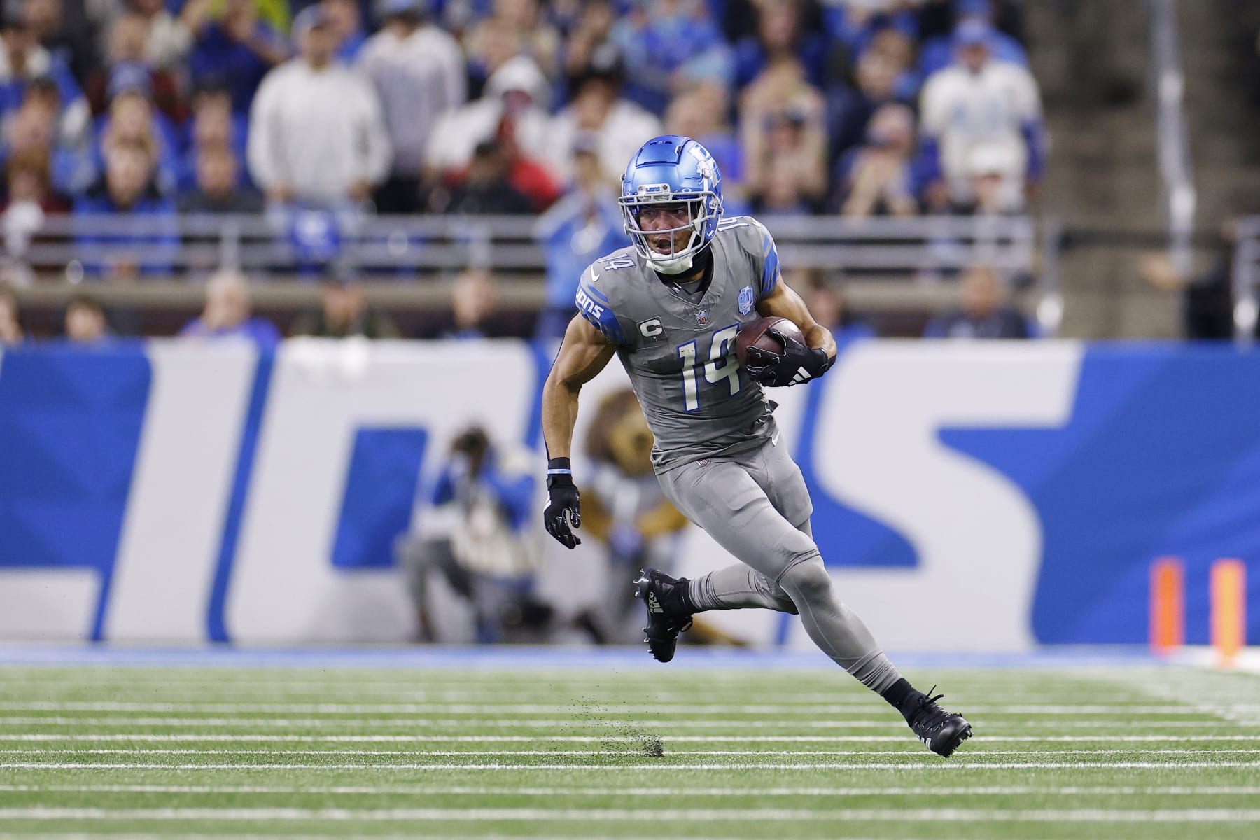DETROIT, MICHIGAN - OCTOBER 30: Amon-Ra St. Brown #14 of the Detroit Lions carries the ball in the second quarter against the Las Vegas Raiders at Ford Field on October 30, 2023 in Detroit, Michigan. (Photo by Mike Mulholland/Getty Images)
