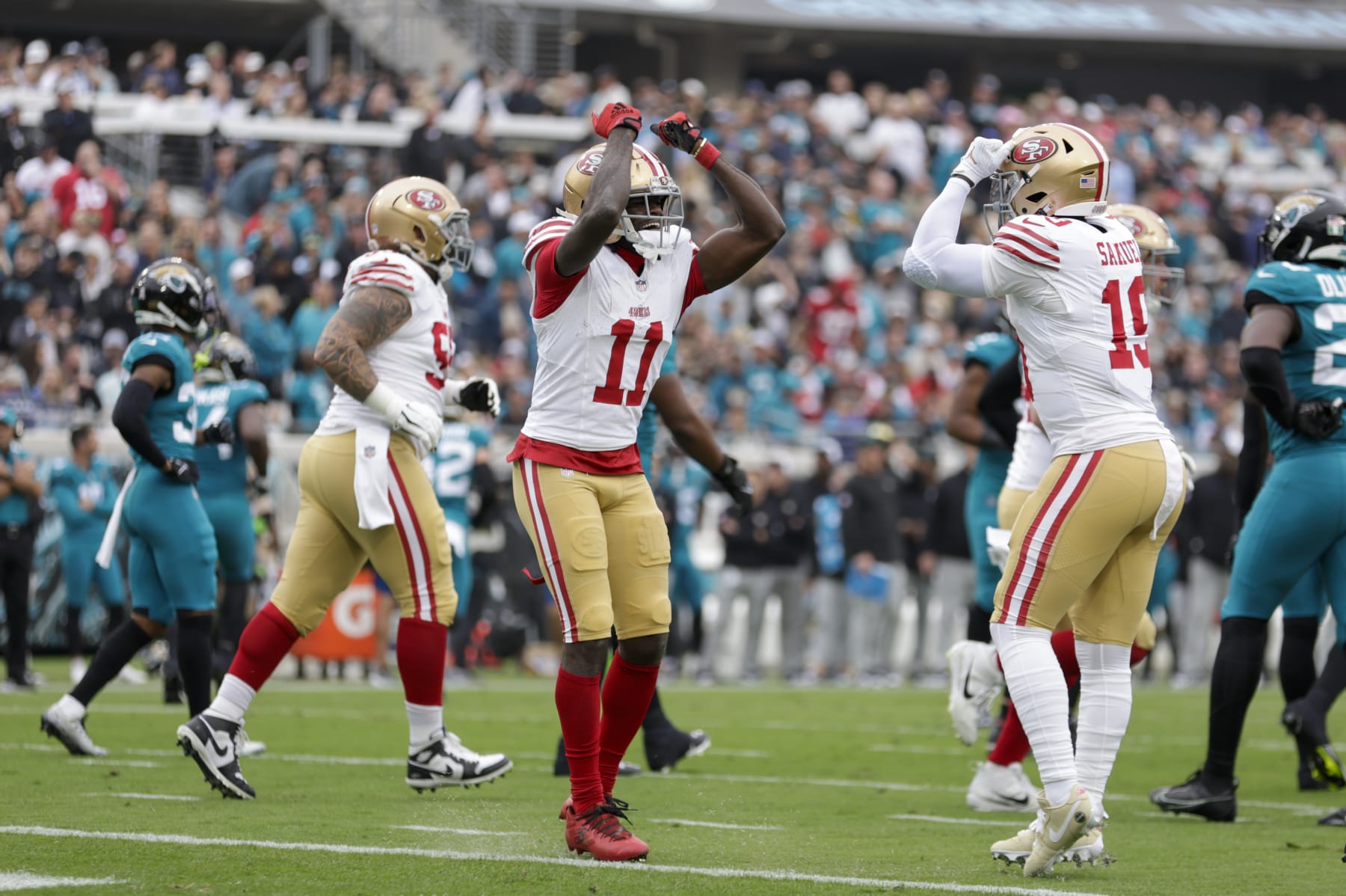 JACKSONVILLE, FL - NOVEMBER 12: San Francisco 49ers wide receiver Brandon Aiyuk (11) and San Francisco 49ers wide receiver Deebo Samuel (19) celebrate a touchdown during the game between the San Francisco 49ers and theJacksonville Jaguars on November 12, 2023 at  EverBank Stadium in Jacksonville, Florida. (Photo by David Rosenblum/Icon Sportswire via Getty Images)