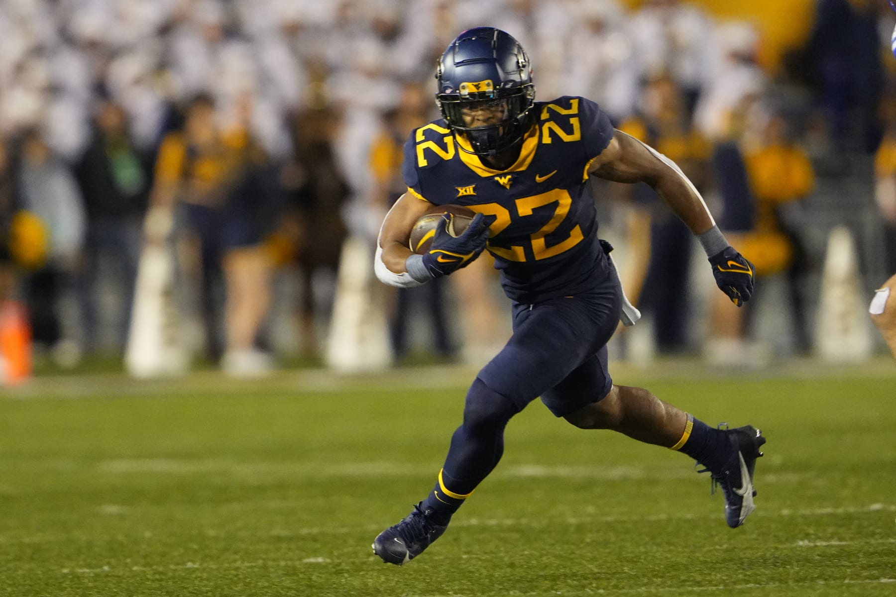 MORGANTOWN, WV - NOVEMBER 04: West Virginia Mountaineers Running Back Jahiem White (22) runs with the ball during the second half of the College Football Game between the Brigham Young Cougars and the West Virginia Mountaineers on November 4, 2023, at Mountaineer Field at Milan Puskar Stadium in Morgantown, WV. (Photo by Gregory Fisher/Icon Sportswire via Getty Images)