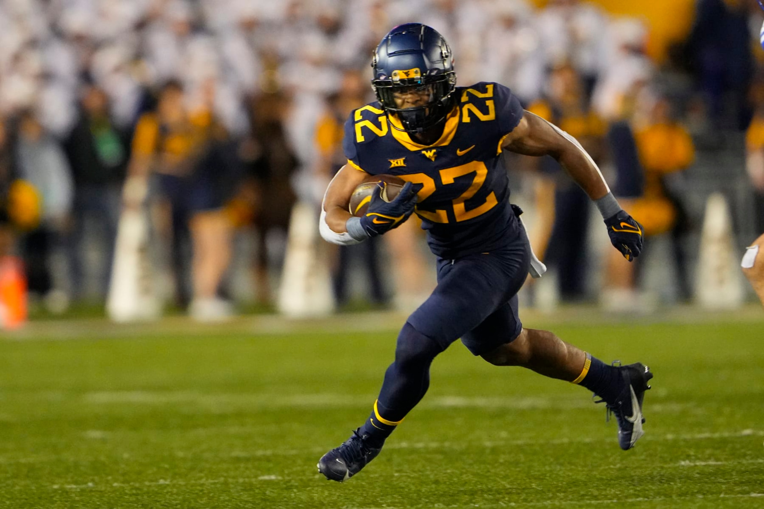 MORGANTOWN, WV - NOVEMBER 04: West Virginia Mountaineers Running Back Jahiem White (22) runs with the ball during the second half of the College Football Game between the Brigham Young Cougars and the West Virginia Mountaineers on November 4, 2023, at Mountaineer Field at Milan Puskar Stadium in Morgantown, WV. (Photo by Gregory Fisher/Icon Sportswire via Getty Images) MORGANTOWN, WV - NOVEMBER 04: West Virginia Mountaineers Running Back Jahiem White (22) runs with the ball during the second half of the College Football Game between the Brigham Young Cougars and the West Virginia Mountaineers on November 4, 2023, at Mountaineer Field at Milan Puskar Stadium in Morgantown, WV. (Photo by Gregory Fisher/Icon Sportswire via Getty Images)