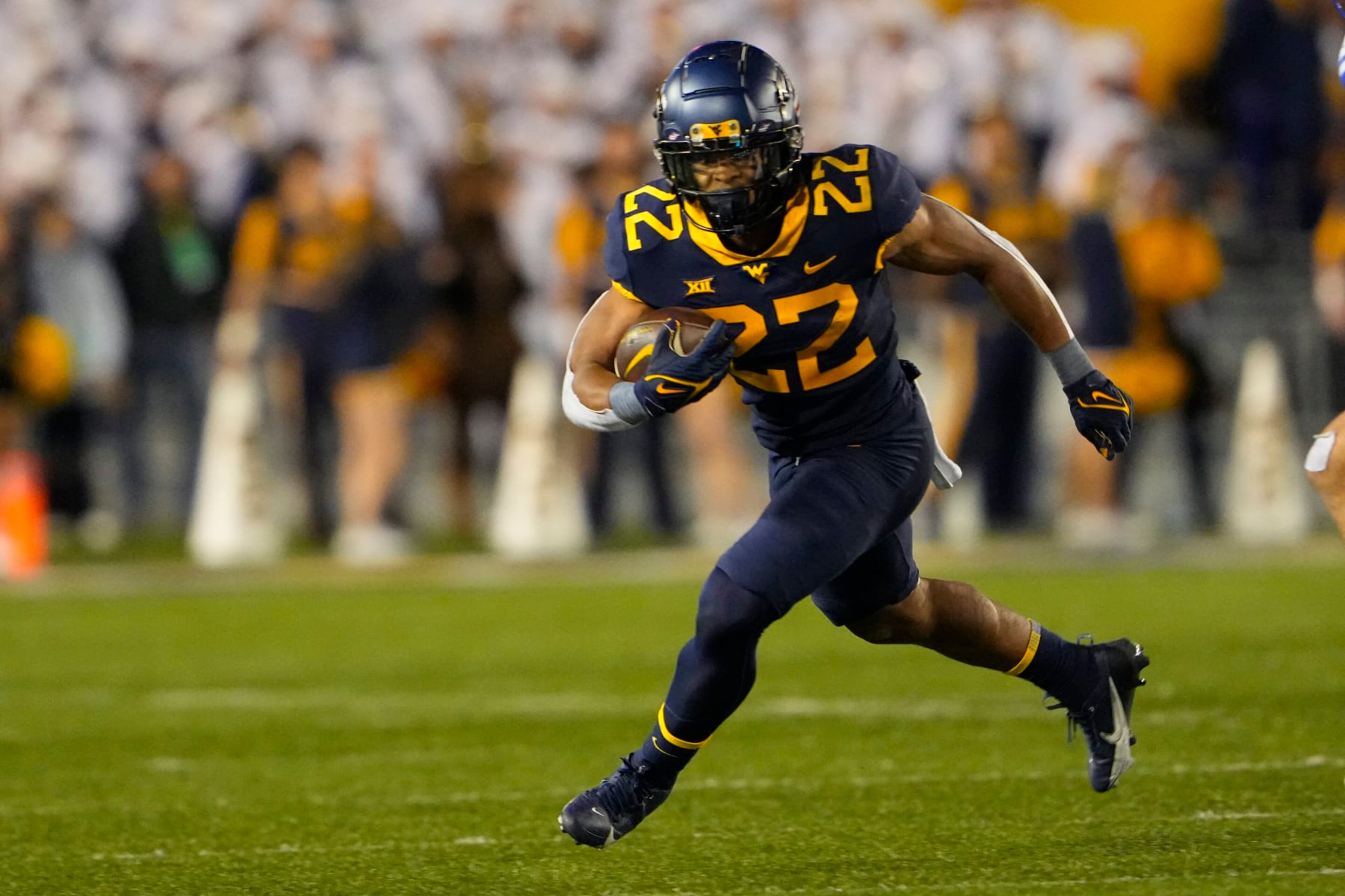 MORGANTOWN, WV - NOVEMBER 04: West Virginia Mountaineers Running Back Jahiem White (22) runs with the ball during the second half of the College Football Game between the Brigham Young Cougars and the West Virginia Mountaineers on November 4, 2023, at Mountaineer Field at Milan Puskar Stadium in Morgantown, WV. (Photo by Gregory Fisher/Icon Sportswire via Getty Images) MORGANTOWN, WV - NOVEMBER 04: West Virginia Mountaineers Running Back Jahiem White (22) runs with the ball during the second half of the College Football Game between the Brigham Young Cougars and the West Virginia Mountaineers on November 4, 2023, at Mountaineer Field at Milan Puskar Stadium in Morgantown, WV. (Photo by Gregory Fisher/Icon Sportswire via Getty Images)