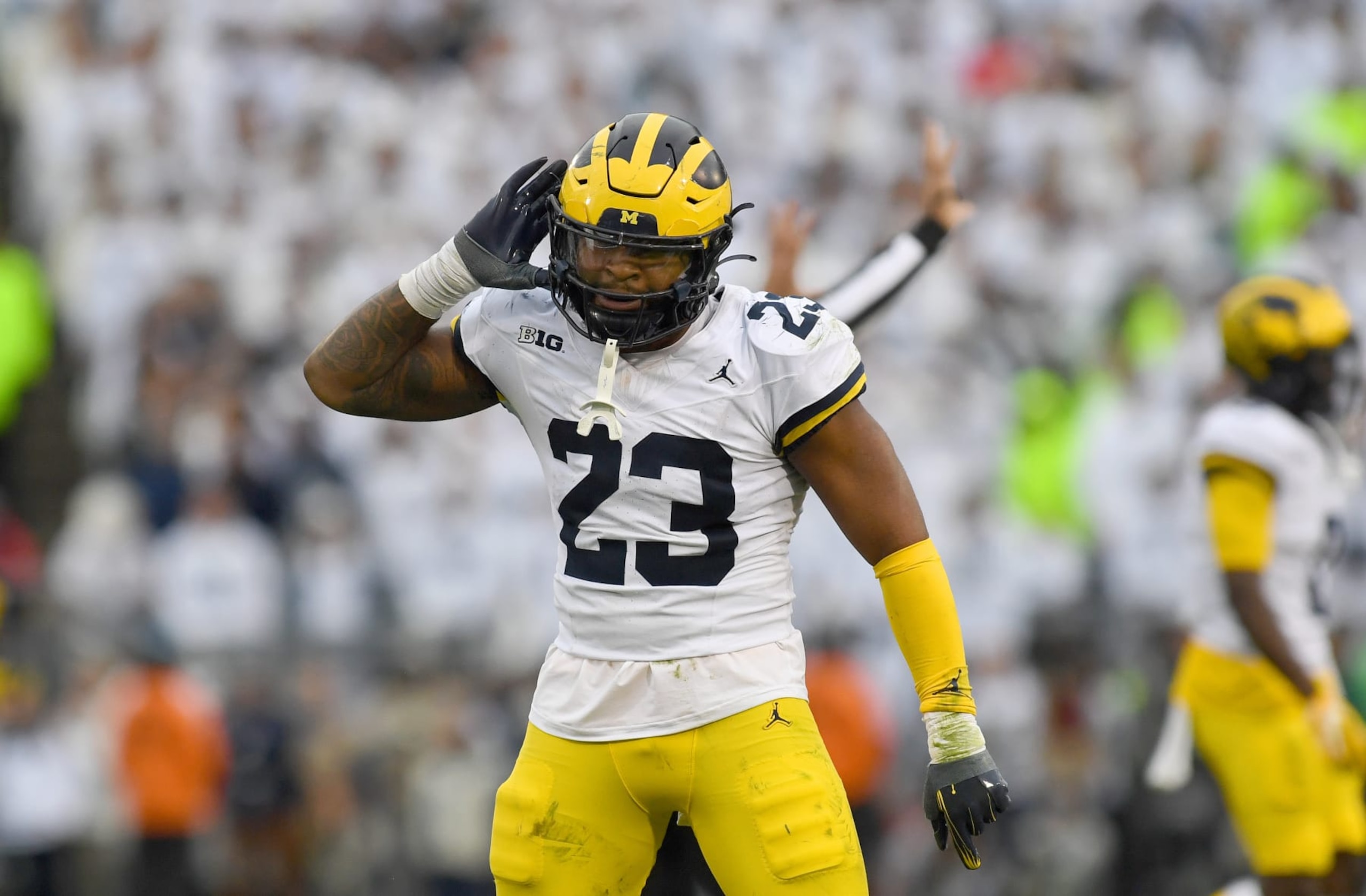 UNIVERSITY PARK, PA - NOVEMBER 11: Michigan linebacker Michael Barrett (23) celebrates after a stop during the Michigan Wolverines versus Penn State Nittany Lions game on November 11, 2023 at Beaver Stadium in University Park, PA. (Photo by Randy Litzinger/Icon Sportswire via Getty Images)