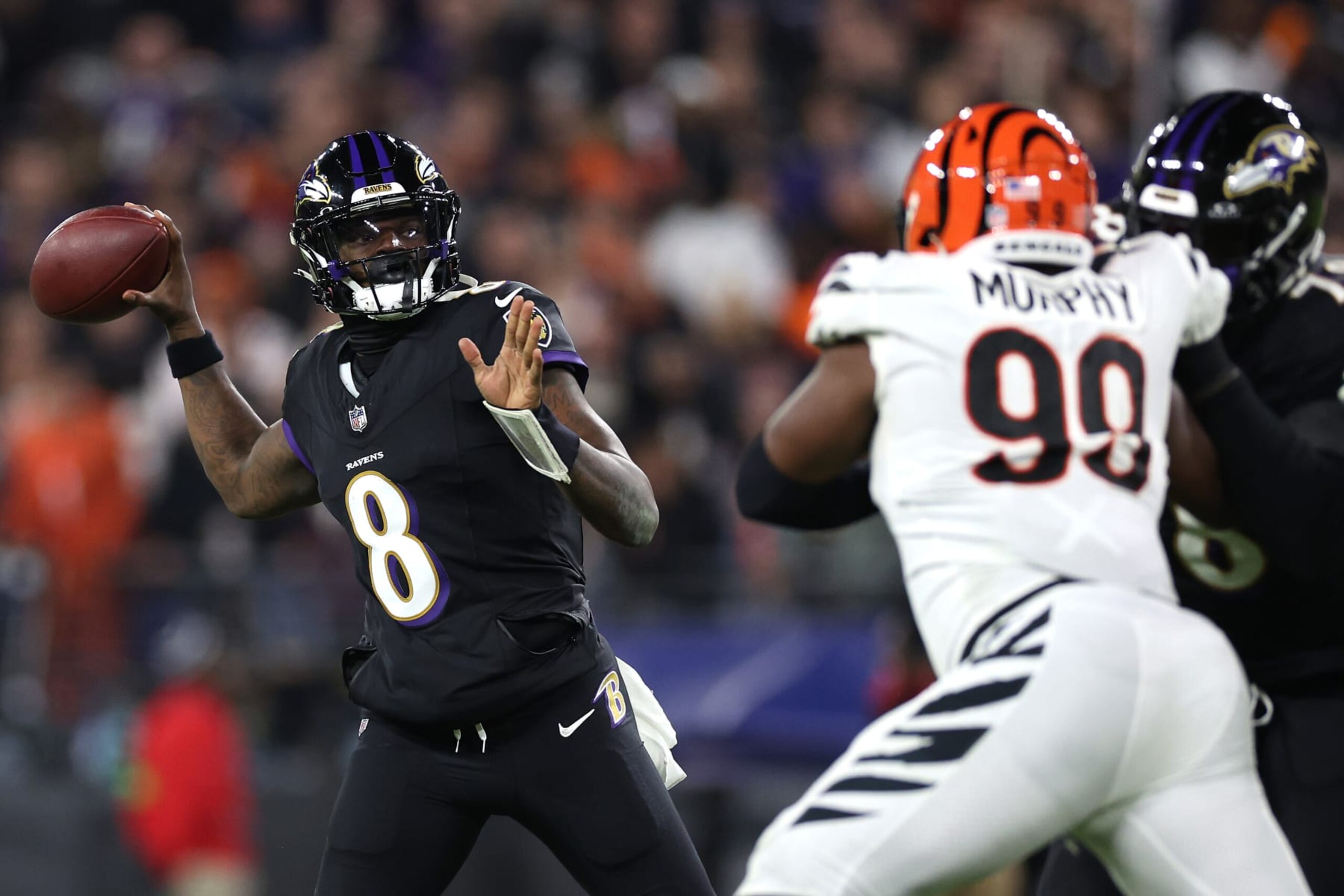 BALTIMORE, MARYLAND - NOVEMBER 16: Lamar Jackson #8 of the Baltimore Ravens throws a pass against the Cincinnati Bengals during the third quarter of the game at M&T Bank Stadium on November 16, 2023 in Baltimore, Maryland. (Photo by Patrick Smith/Getty Images)