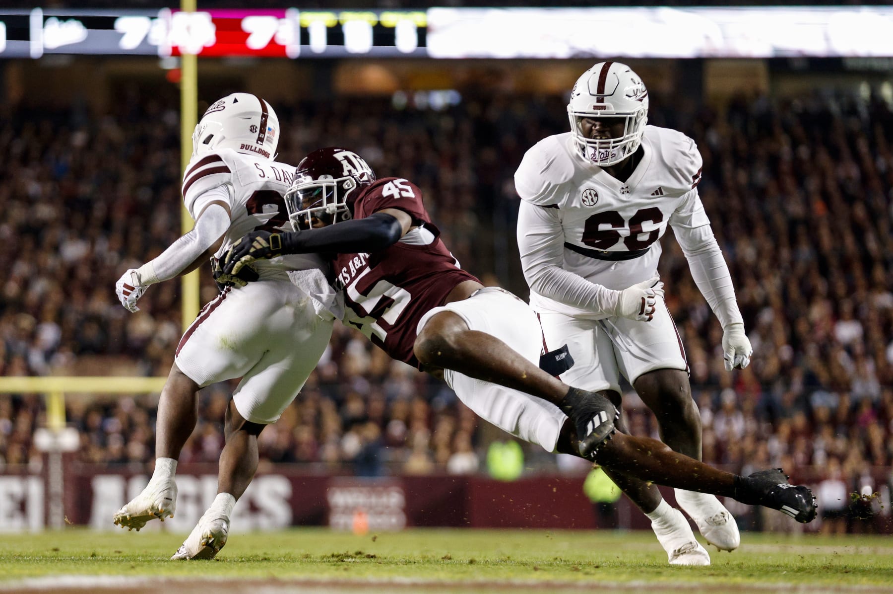 COLLEGE STATION, TEXAS - NOVEMBER 11: Edgerrin Cooper #45 of the Texas A&M Aggies tackles Seth Davis #23 of the Mississippi State Bulldogs near the goal line in the first quarter at Kyle Field on November 11, 2023 in College Station, Texas. (Photo by Tim Warner/Getty Images)