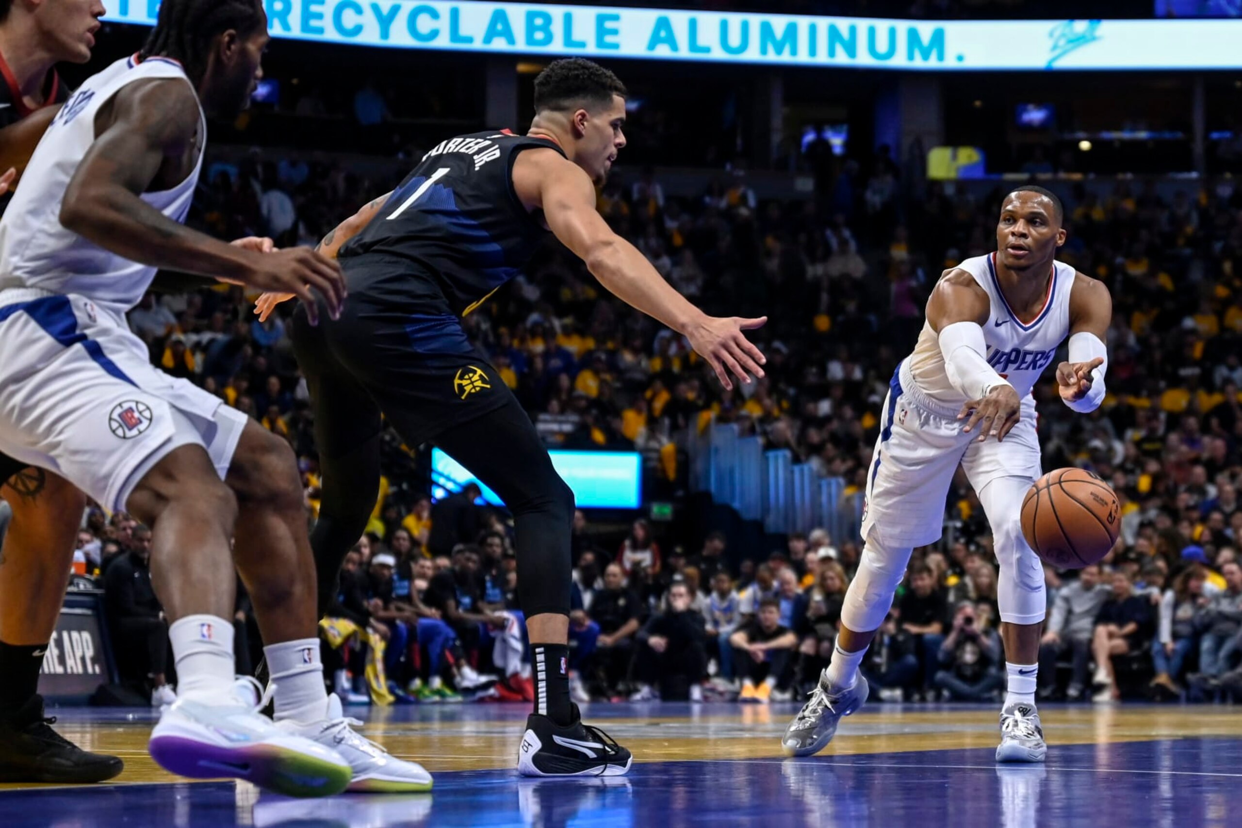 DENVER, CO - NOVEMBER 14: Russell Westbrook (0) of the LA Clippers looks to feed Kawhi Leonard (2) as Michael Porter Jr. (1) of the Denver Nuggets defends during the first quarter at Ball Arena in Denver on Tuesday, November 14, 2023. (Photo by AAron Ontiveroz/The Denver Post) DENVER, CO - NOVEMBER 14: Russell Westbrook (0) of the LA Clippers looks to feed Kawhi Leonard (2) as Michael Porter Jr. (1) of the Denver Nuggets defends during the first quarter at Ball Arena in Denver on Tuesday, November 14, 2023. (Photo by AAron Ontiveroz/The Denver Post)