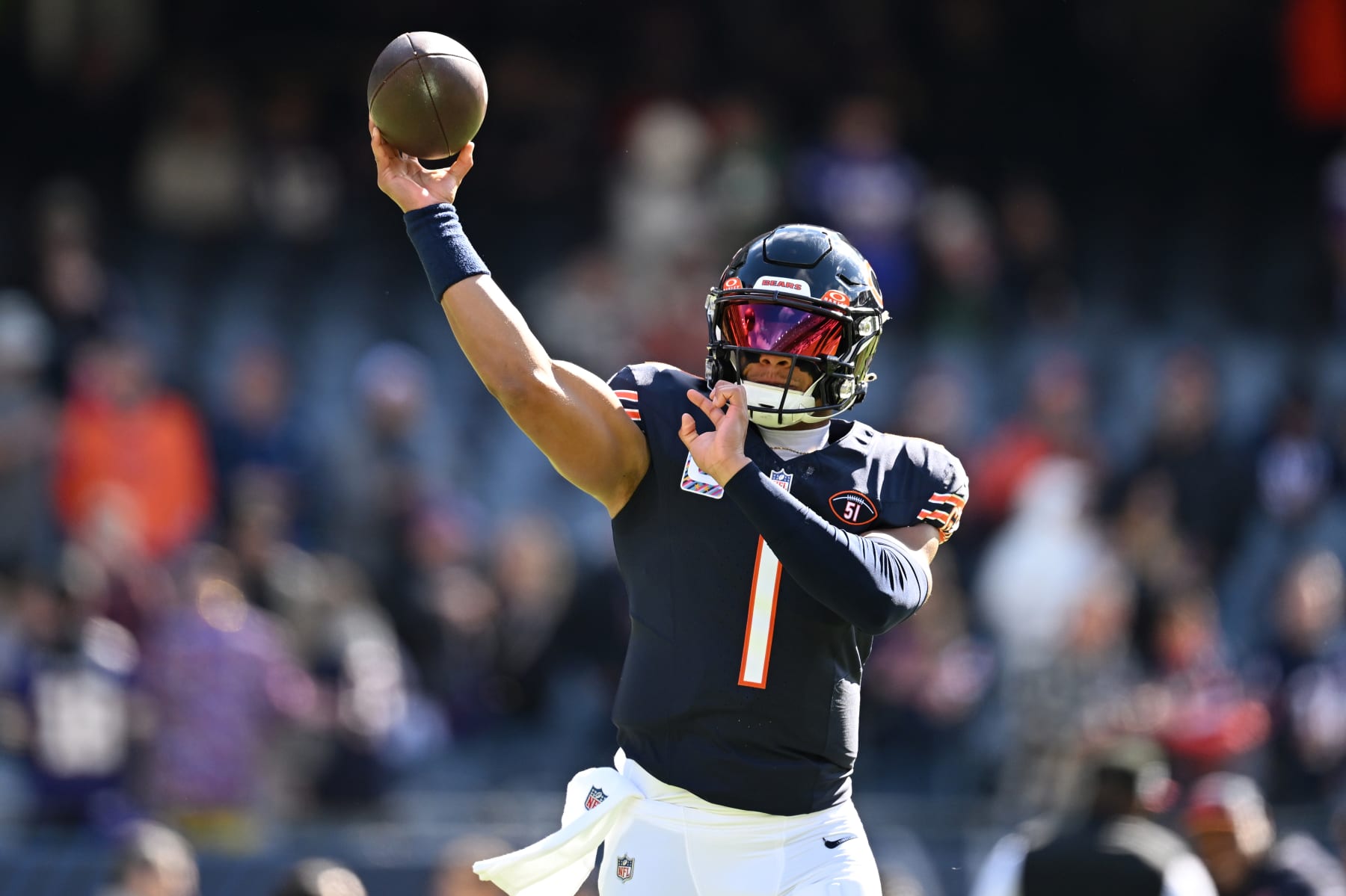 CHICAGO, ILLINOIS - OCTOBER 15: Justin Fields #1 of the Chicago Bears warms up before the game against the Minnesota Vikings at Soldier Field on October 15, 2023 in Chicago, Illinois. (Photo by Quinn Harris/Getty Images)