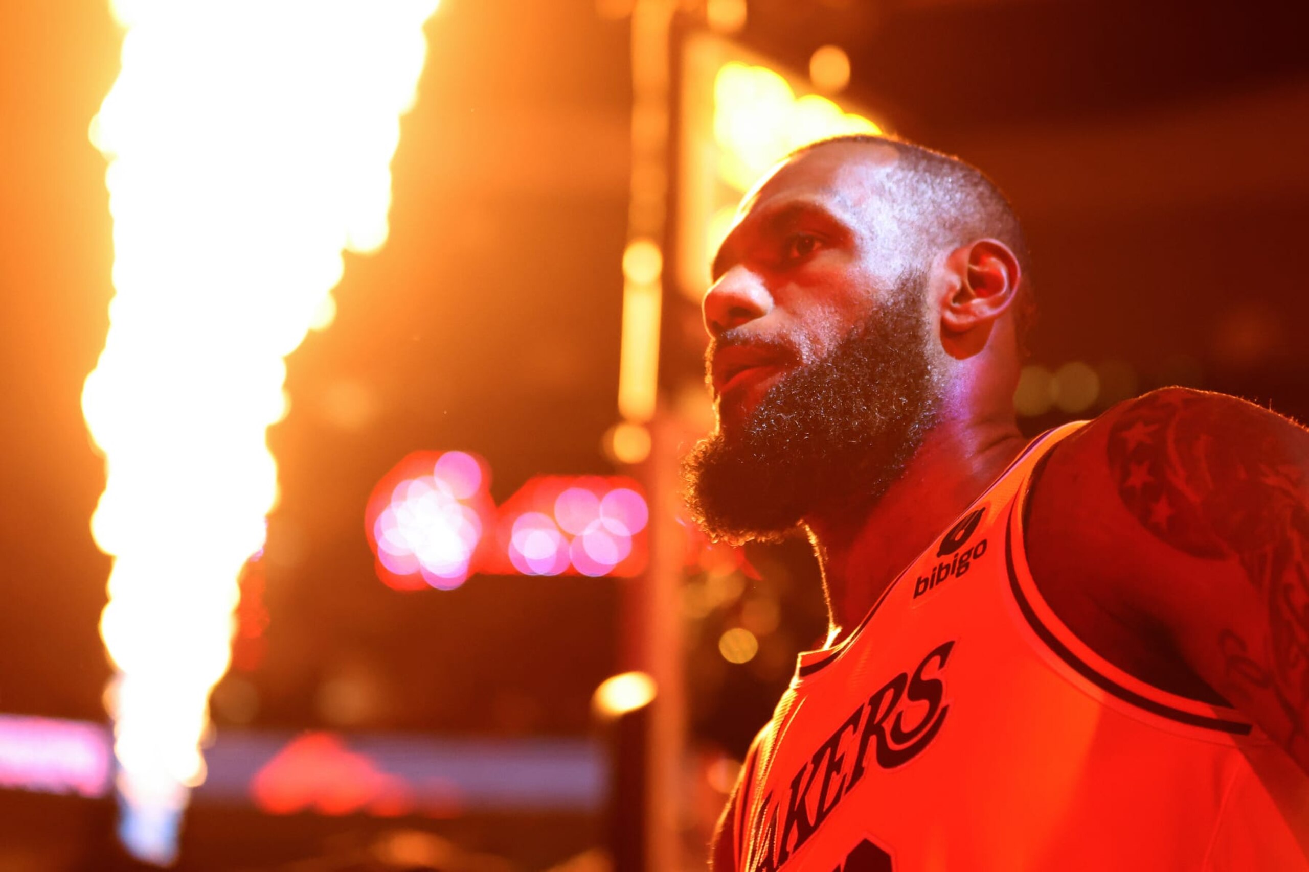 PORTLAND, OREGON - NOVEMBER 17: Flames illuminate LeBron James #23 of the Los Angeles Lakers before the game against the Portland Trail Blazers at Moda Center on November 17, 2023 in Portland, Oregon. NOTE TO USER: User expressly acknowledges and agrees that, by downloading and or using this photograph, User is consenting to the terms and conditions of the Getty Images License Agreement. (Photo by Steph Chambers/Getty Images)