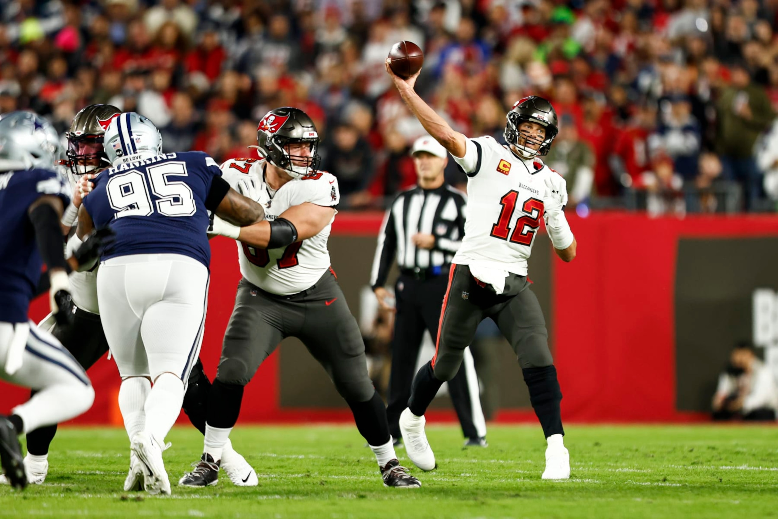 TAMPA, FL - JANUARY 16: Tom Brady #12 of the Tampa Bay Buccaneers throws a pass during an NFL wild card playoff football game against the Dallas Cowboys at Raymond James Stadium on January 16, 2023 in Tampa, Florida. (Photo by Kevin Sabitus/Getty Images)