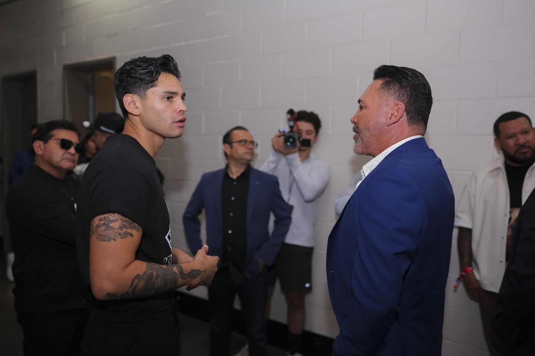 HOUSTON, TEXAS - OCTOBER 25: Ryan Garcia (L) speaks with Oscar De La Hoya (R) ahead of a press conference to promote his fight against Oscar Duarte at Toyota Center on October 25, 2023 in Houston, Texas. (Photo by Cris Esqueda/Golden Boy/Getty Images)