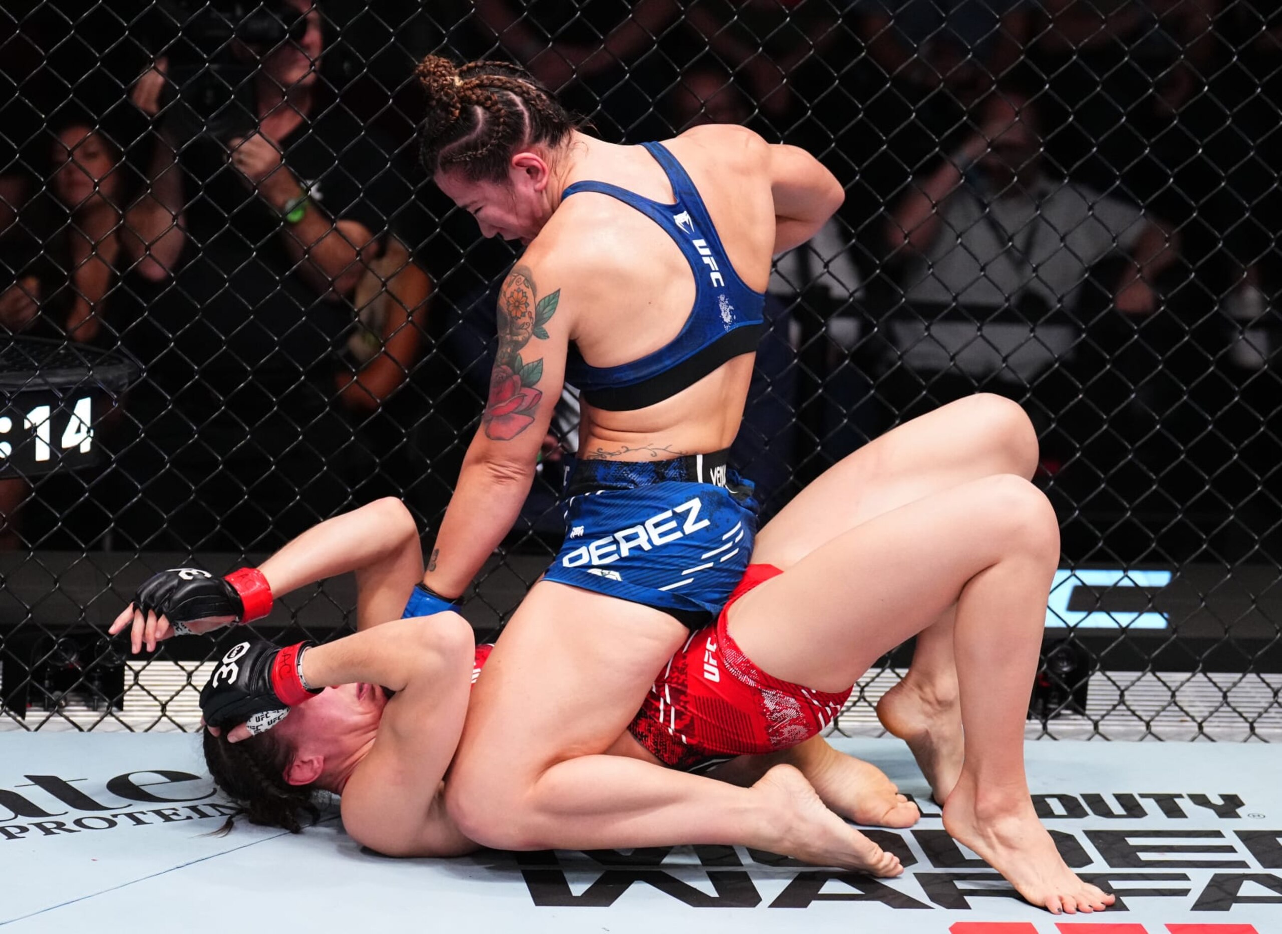 LAS VEGAS, NEVADA - NOVEMBER 18: (R-L) Ailin Perez of Argentina punches Lucie Pudilova of the Czech Republic in a bantamweight fight during the UFC Fight Night event at UFC APEX on November 18, 2023 in Las Vegas, Nevada. (Photo by Chris Unger/Zuffa LLC via Getty Images)