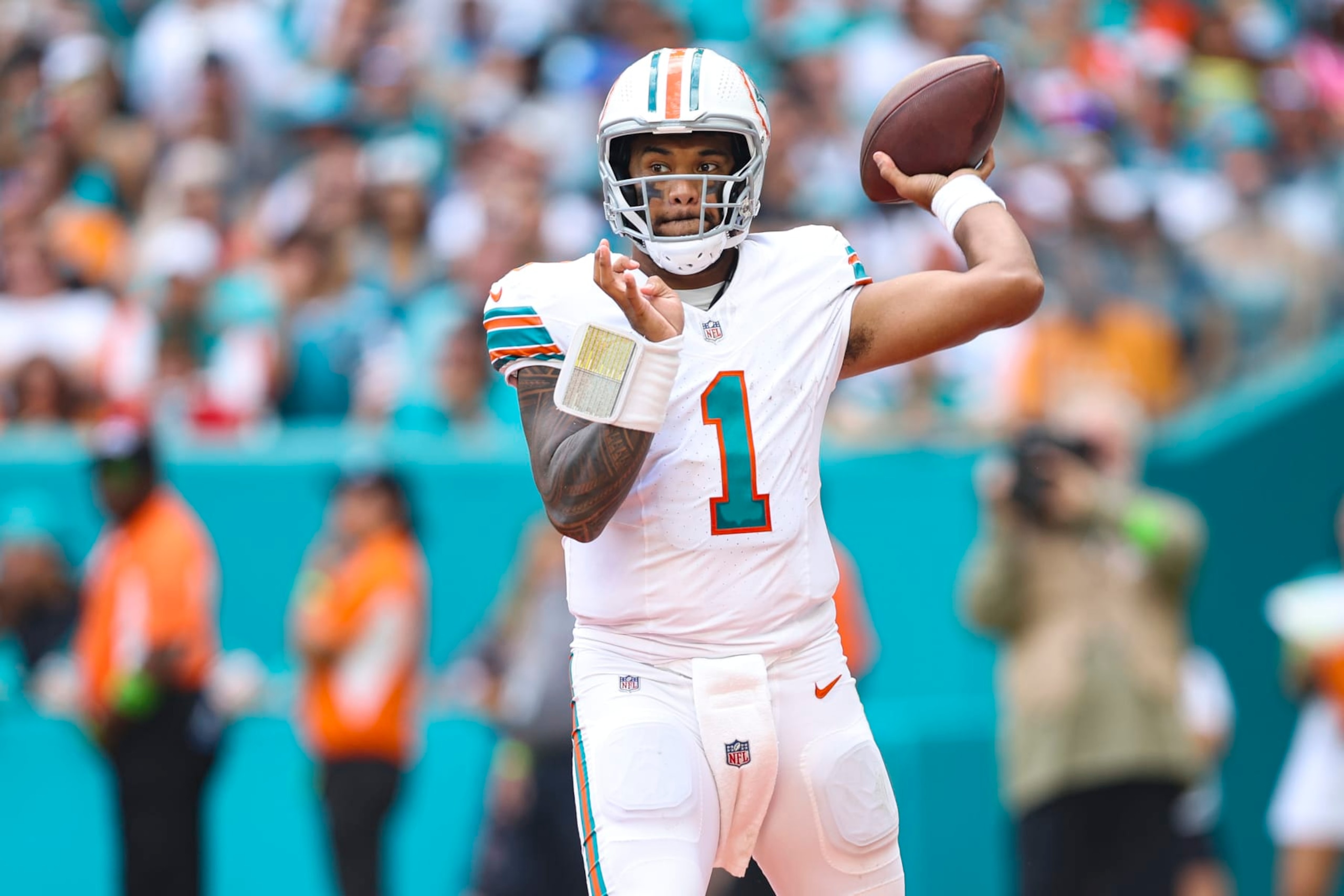 MIAMI GARDENS, FL - OCTOBER 29: Tua Tagovailoa #1 of the Miami Dolphins throws the ball during an NFL football game against the New England Patriots at Hard Rock Stadium on October 29, 2023 in Miami Gardens, Florida. (Photo by Perry Knotts/Getty Images) MIAMI GARDENS, FL - OCTOBER 29: Tua Tagovailoa #1 of the Miami Dolphins throws the ball during an NFL football game against the New England Patriots at Hard Rock Stadium on October 29, 2023 in Miami Gardens, Florida. (Photo by Perry Knotts/Getty Images)