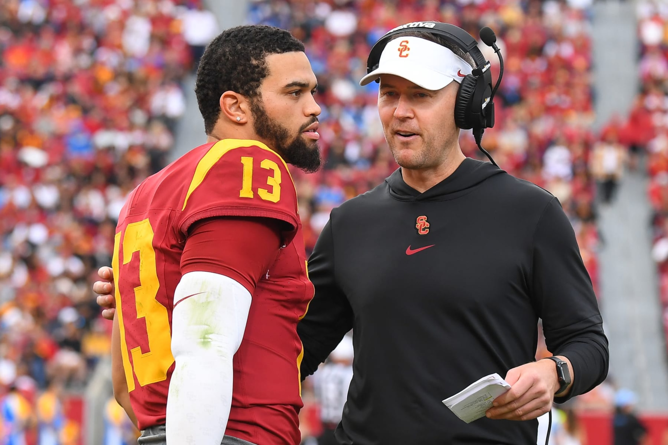 LOS ANGELES, CA - NOVEMBER 18: USC Trojans quarterback Caleb Williams (13) talks with USC Trojans head coach Lincoln Riley during a college football game between the UCLA Bruins and the USC Trojans on November 18, 2023, at Los Angeles Memorial Coliseum in Los Angeles, CA. (Photo by Brian Rothmuller/Icon Sportswire via Getty Images) LOS ANGELES, CA - NOVEMBER 18: USC Trojans quarterback Caleb Williams (13) talks with USC Trojans head coach Lincoln Riley during a college football game between the UCLA Bruins and the USC Trojans on November 18, 2023, at Los Angeles Memorial Coliseum in Los Angeles, CA. (Photo by Brian Rothmuller/Icon Sportswire via Getty Images)