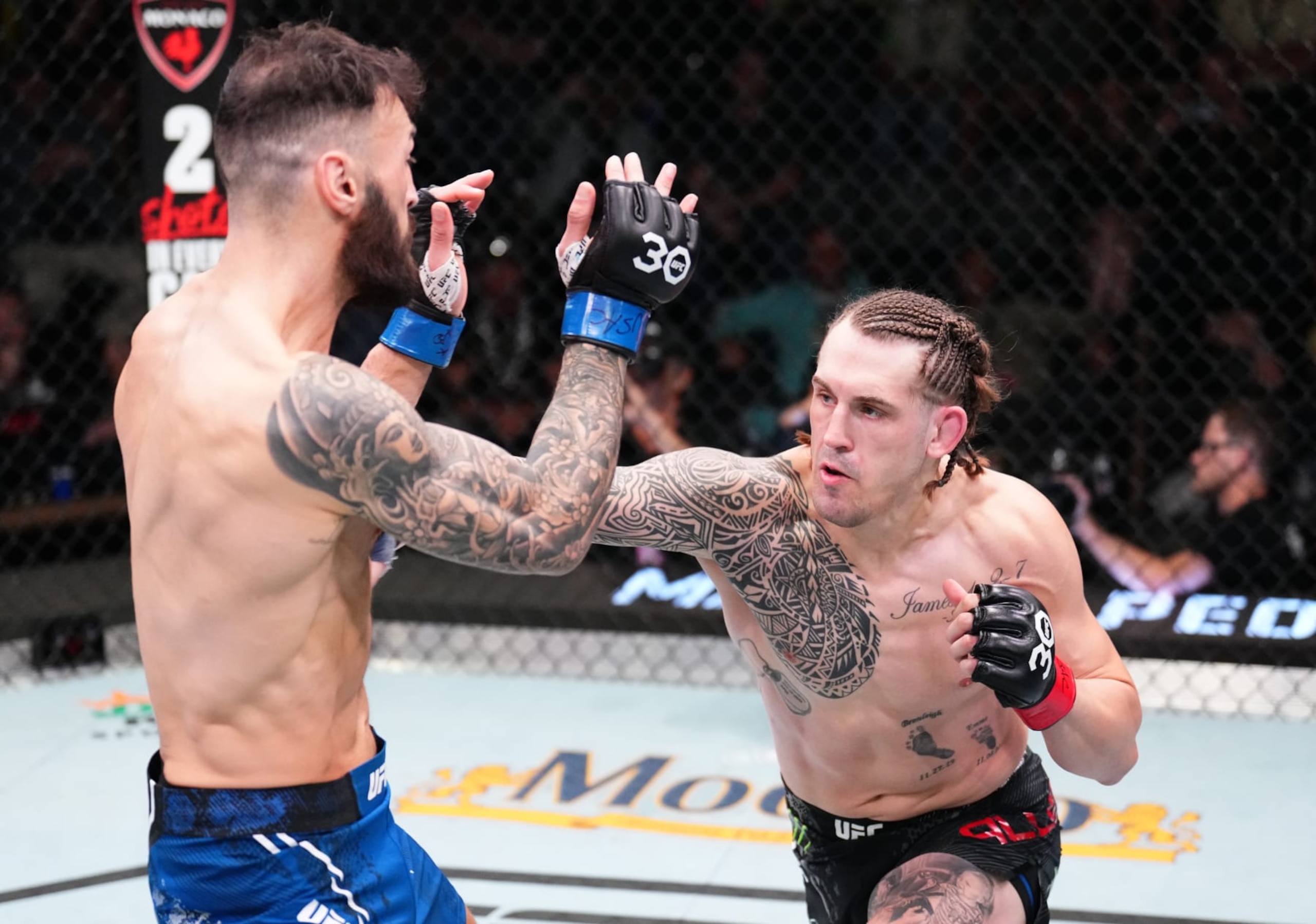 LAS VEGAS, NEVADA - NOVEMBER 18: (R-L) Brendan Allen punches Paul Craig of Scotland in a middleweight fight during the UFC Fight Night event at UFC APEX on November 18, 2023 in Las Vegas, Nevada. (Photo by Chris Unger/Zuffa LLC via Getty Images)