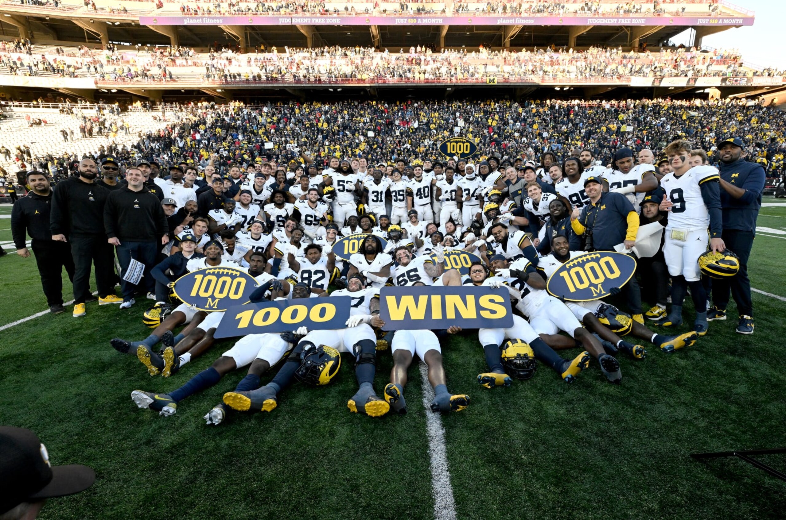 COLLEGE PARK, MARYLAND - NOVEMBER 18: The Michigan Wolverines celebrate the 1000th win in program history after a 31-24 victory against the Maryland Terrapins at SECU Stadium on November 18, 2023 in College Park, Maryland. (Photo by Greg Fiume/Getty Images)