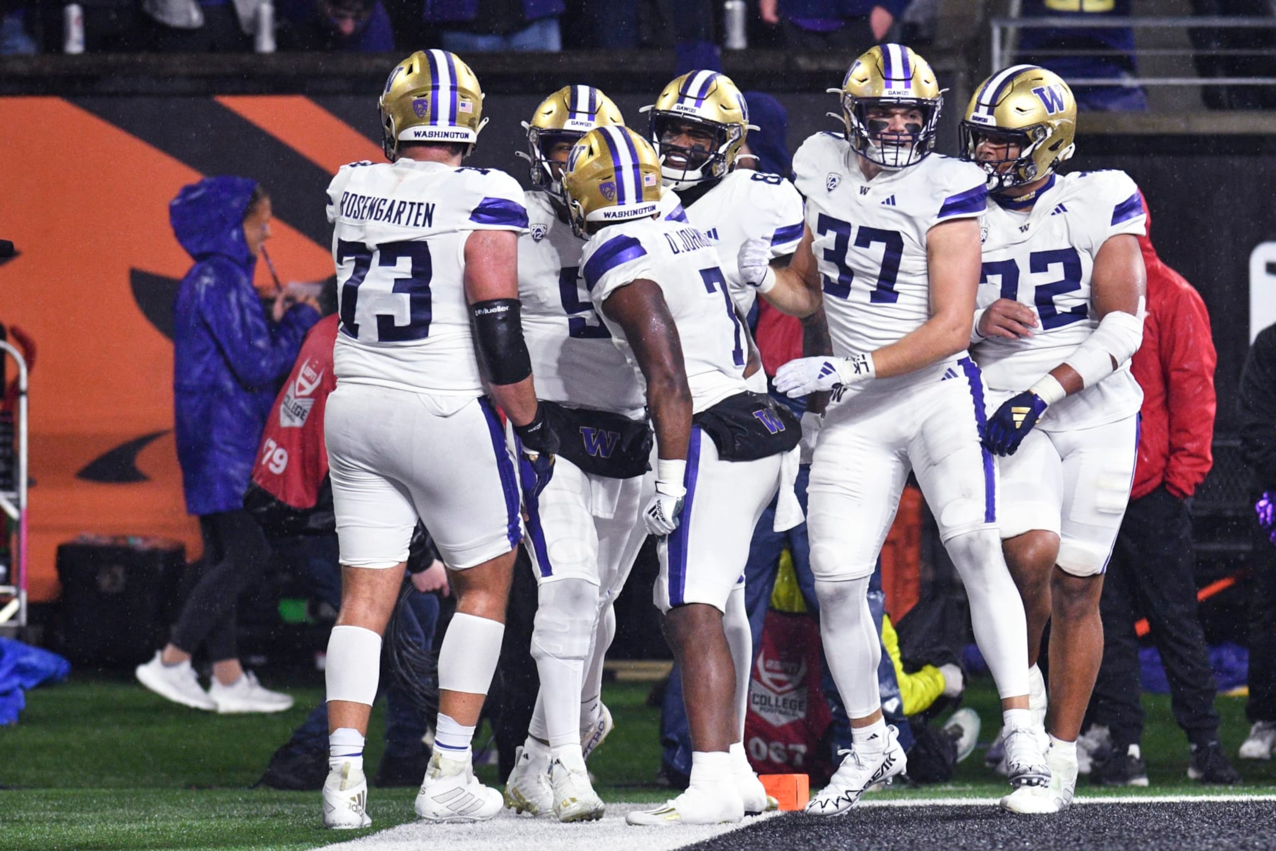 Washington quarterback Michael Penix Jr., second from left, celebrates his touchdown against Oregon State with teammates during the first half of an NCAA college football game Saturday, Nov. 18, 2023, in Corvallis, Ore. (AP Photo/Mark Ylen)