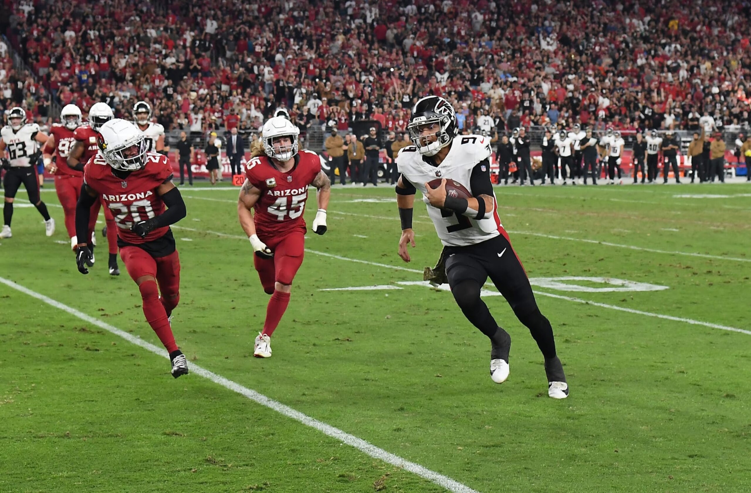 GLENDALE, ARIZONA - NOVEMBER 12: Desmond Ridder #9 of the Atlanta Falcons runs with the ball against the Arizona Cardinals at State Farm Stadium on November 12, 2023 in Glendale, Arizona. (Photo by Norm Hall/Getty Images) GLENDALE, ARIZONA - NOVEMBER 12: Desmond Ridder #9 of the Atlanta Falcons runs with the ball against the Arizona Cardinals at State Farm Stadium on November 12, 2023 in Glendale, Arizona. (Photo by Norm Hall/Getty Images)