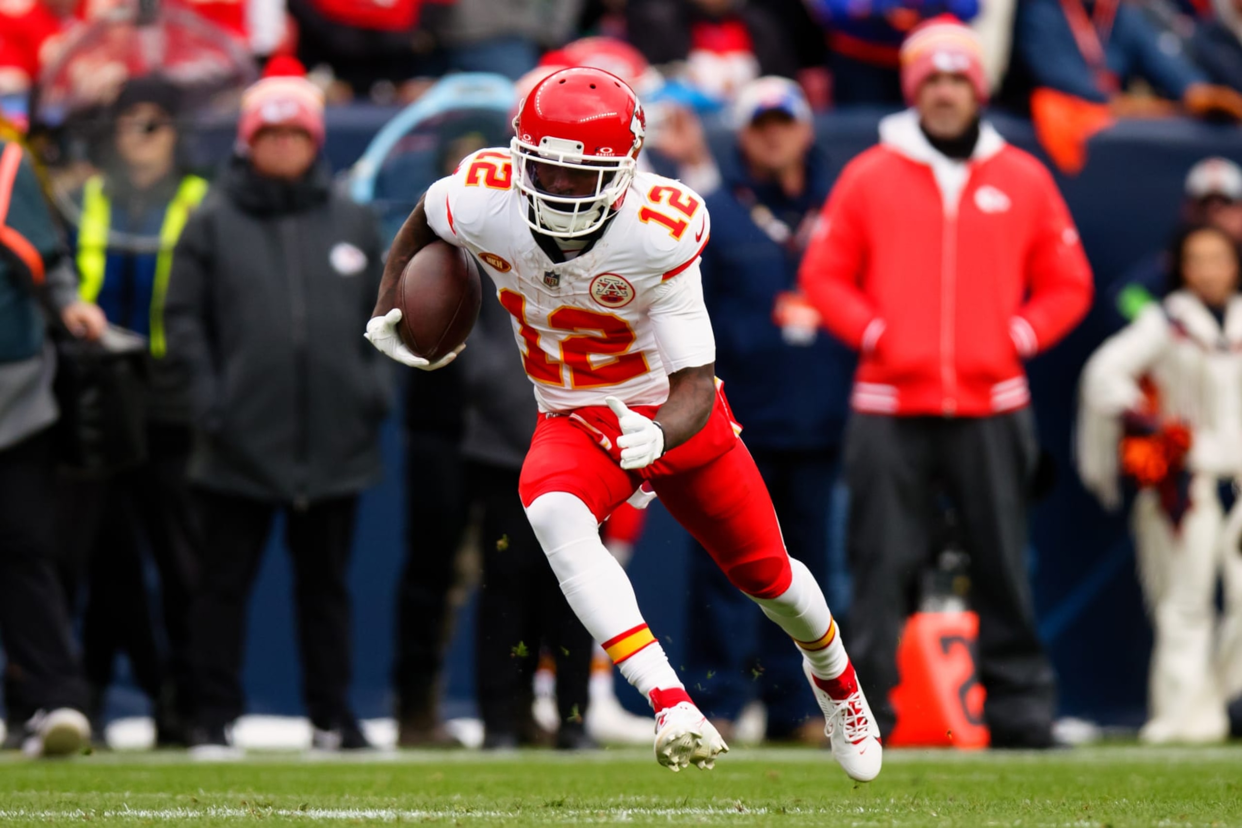 DENVER, CO - OCTOBER 29:  Wide receiver Mecole Hardman Jr. #12 of the Kansas City Chiefs runs with the football during the second quarter against the Denver Broncos at Empower Field at Mile High on October 29, 2023 in Denver, Colorado. (Photo by Justin Edmonds/Getty Images)