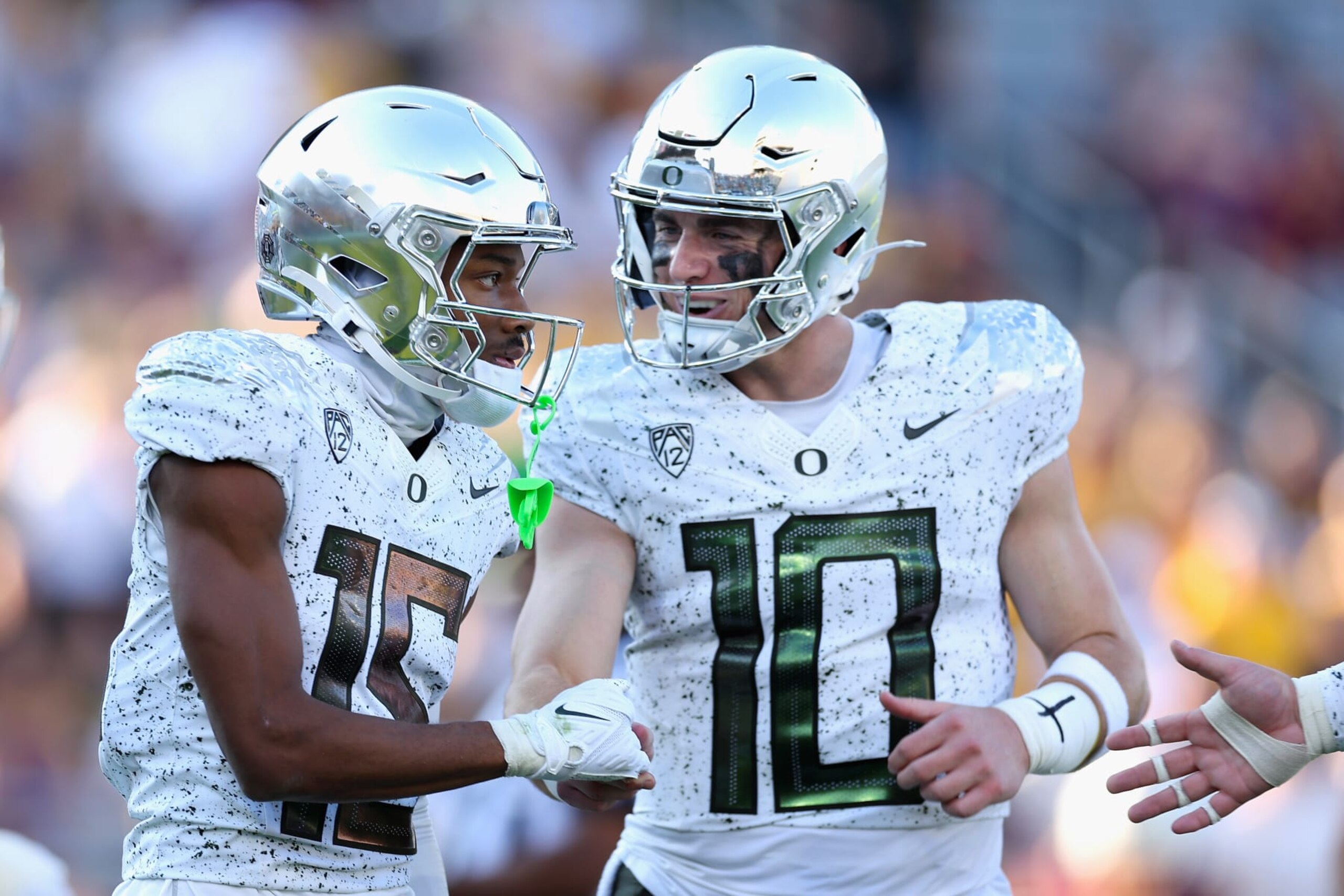 TEMPE, ARIZONA - NOVEMBER 18: Wide receiver Tez Johnson #15 of the Oregon Ducks celebrates with quarterback Bo Nix #10 after catching a 16-yard touchdown reception against the Arizona State Sun Devils during the first half of the NCAAF game at Mountain America Stadium on November 18, 2023 in Tempe, Arizona. (Photo by Christian Petersen/Getty Images) TEMPE, ARIZONA - NOVEMBER 18: Wide receiver Tez Johnson #15 of the Oregon Ducks celebrates with quarterback Bo Nix #10 after catching a 16-yard touchdown reception against the Arizona State Sun Devils during the first half of the NCAAF game at Mountain America Stadium on November 18, 2023 in Tempe, Arizona. (Photo by Christian Petersen/Getty Images)