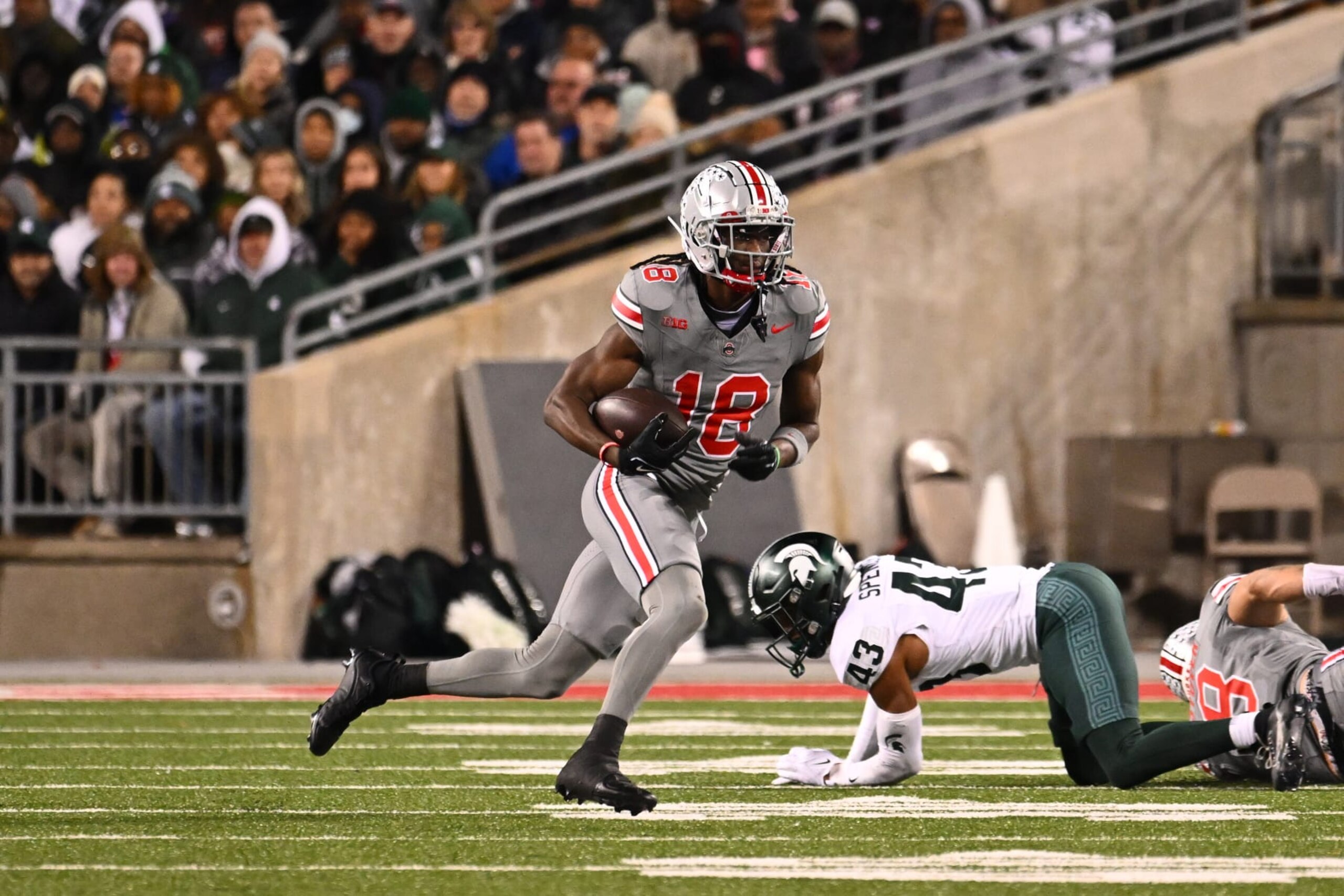 COLUMBUS, OHIO - NOVEMBER 11: Marvin Harrison Jr. #18 of the Ohio State Buckeyes runs with the ball during the second quarter of a game against the Michigan State Spartans at Ohio Stadium on November 11, 2023 in Columbus, Ohio. (Photo by Ben Jackson/Getty Images) COLUMBUS, OHIO - NOVEMBER 11: Marvin Harrison Jr. #18 of the Ohio State Buckeyes runs with the ball during the second quarter of a game against the Michigan State Spartans at Ohio Stadium on November 11, 2023 in Columbus, Ohio. (Photo by Ben Jackson/Getty Images)