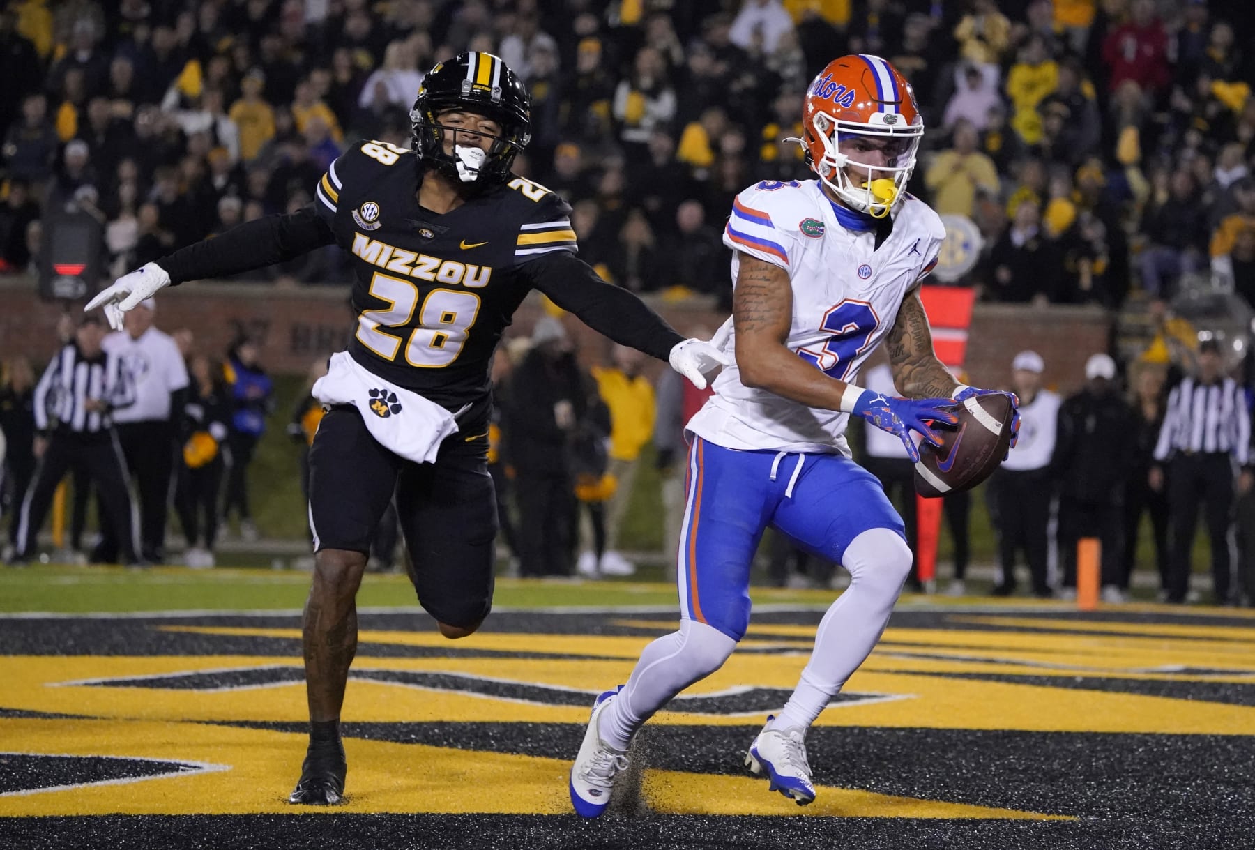 COLUMBIA, MISSOURI - NOVEMBER 18: Wide receiver Eugene Wilson III #3 of the Florida Gators catches a pass for a touchdown against defensive back Joseph Charleston #28 of the Missouri Tigers in the first half at Faurot Field/Memorial Stadium on November 18, 2023 in Columbia, Missouri. (Photo by Ed Zurga/Getty Images)