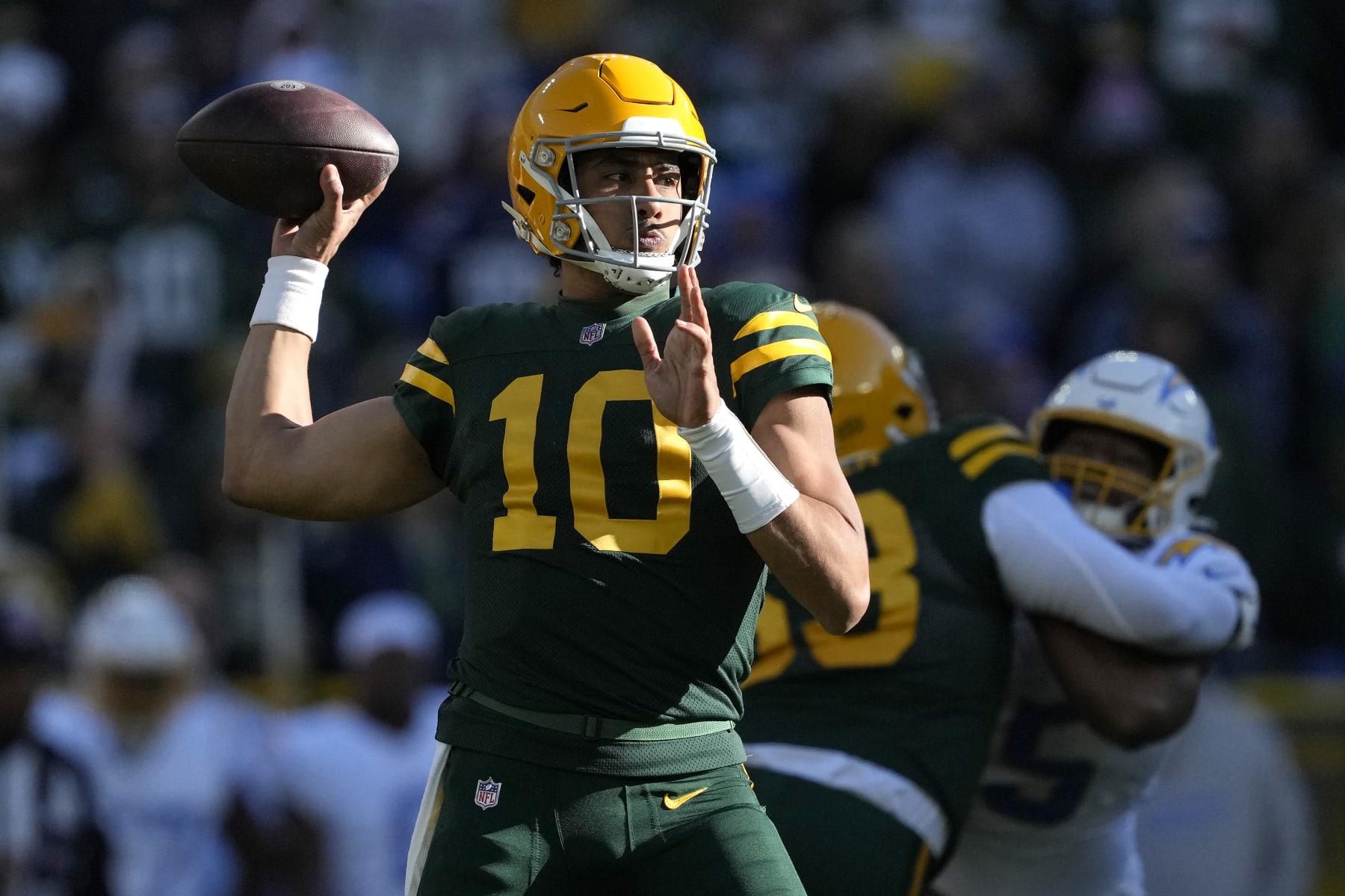 GREEN BAY, WISCONSIN - NOVEMBER 19: Jordan Love #10 of the Green Bay Packers throws a pass in the first quarter against the Los Angeles Chargers at Lambeau Field on November 19, 2023 in Green Bay, Wisconsin. (Photo by Patrick McDermott/Getty Images)