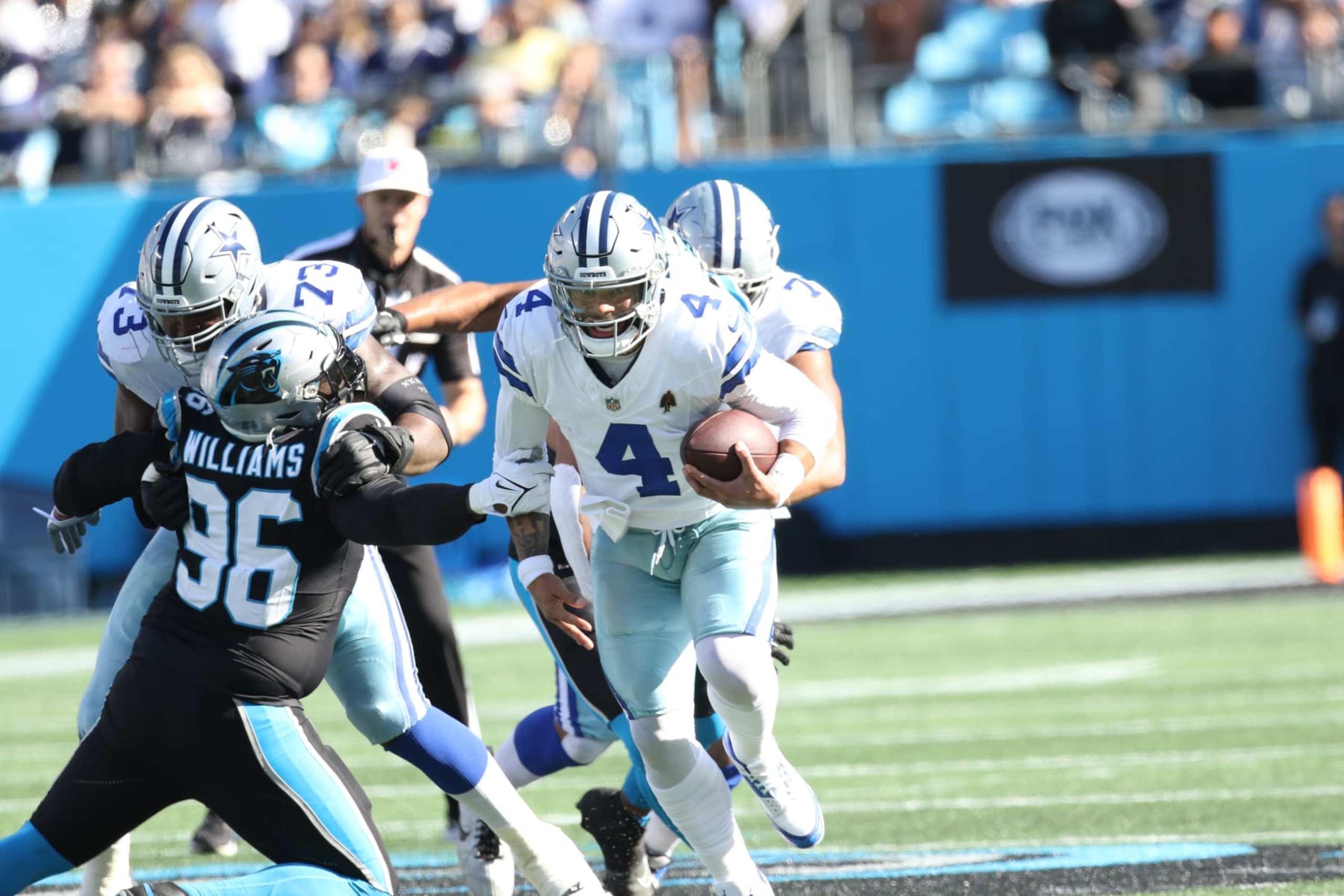 CHARLOTTE, NC - NOVEMBER 19: Dallas Cowboys quarterback Dak Prescott (4) runs with the ball during an NFL football game between the Dallas Cowboys and the Carolina Panthers on November 19, 2023 at Bank of America Stadium in Charlotte, N.C. (Photo by John Byrum/Icon Sportswire via Getty Images) CHARLOTTE, NC - NOVEMBER 19: Dallas Cowboys quarterback Dak Prescott (4) runs with the ball during an NFL football game between the Dallas Cowboys and the Carolina Panthers on November 19, 2023 at Bank of America Stadium in Charlotte, N.C. (Photo by John Byrum/Icon Sportswire via Getty Images)