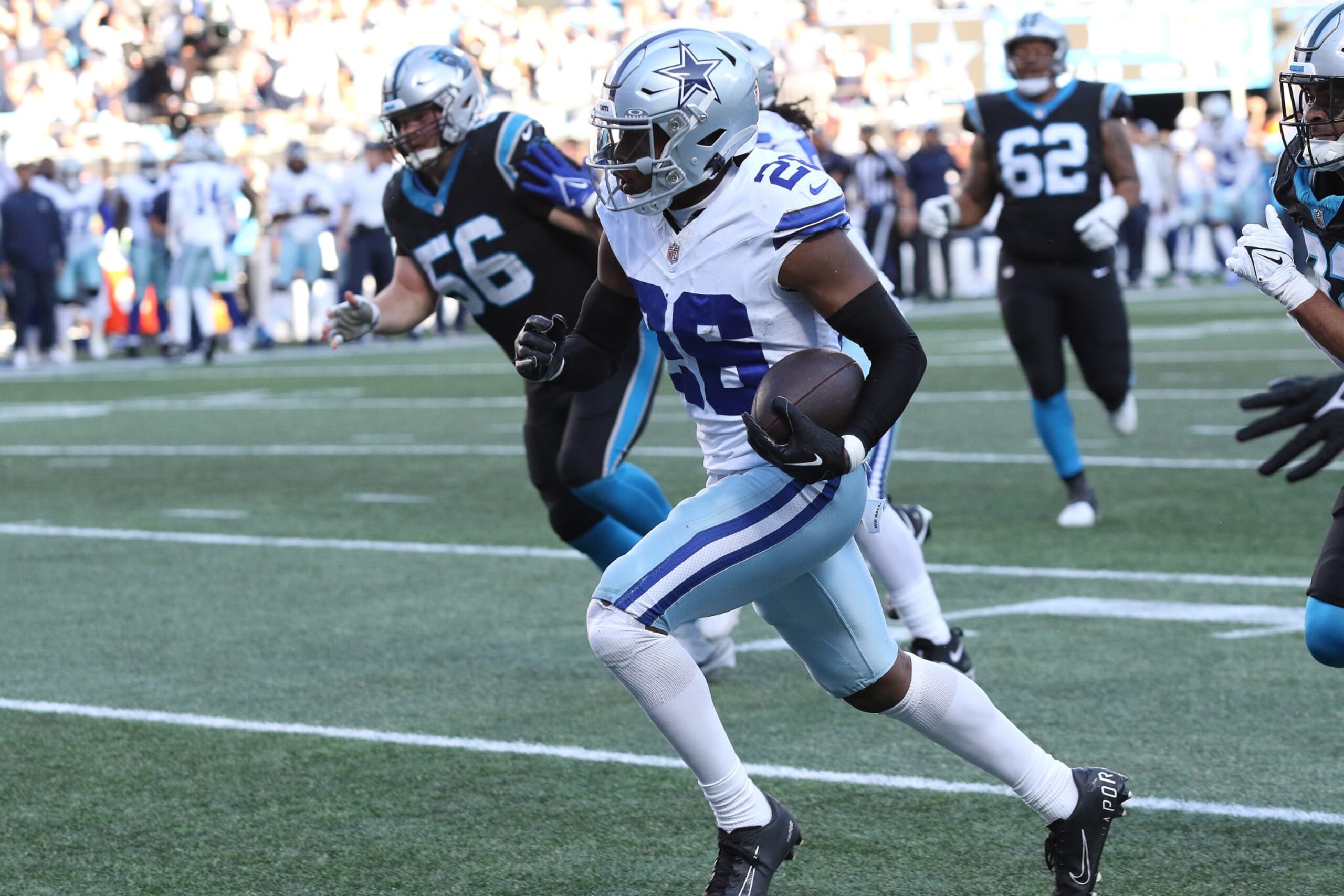 CHARLOTTE, NC - NOVEMBER 19: Dallas Cowboys corner back DaRon Bland (26) on his way to score a touch down off an interception during an NFL football game between the Dallas Cowboys and the Carolina Panthers on November 19, 2023 at Bank of America Stadium in Charlotte, N.C. (Photo by John Byrum/Icon Sportswire via Getty Images) CHARLOTTE, NC - NOVEMBER 19: Dallas Cowboys corner back DaRon Bland (26) on his way to score a touch down off an interception during an NFL football game between the Dallas Cowboys and the Carolina Panthers on November 19, 2023 at Bank of America Stadium in Charlotte, N.C. (Photo by John Byrum/Icon Sportswire via Getty Images)