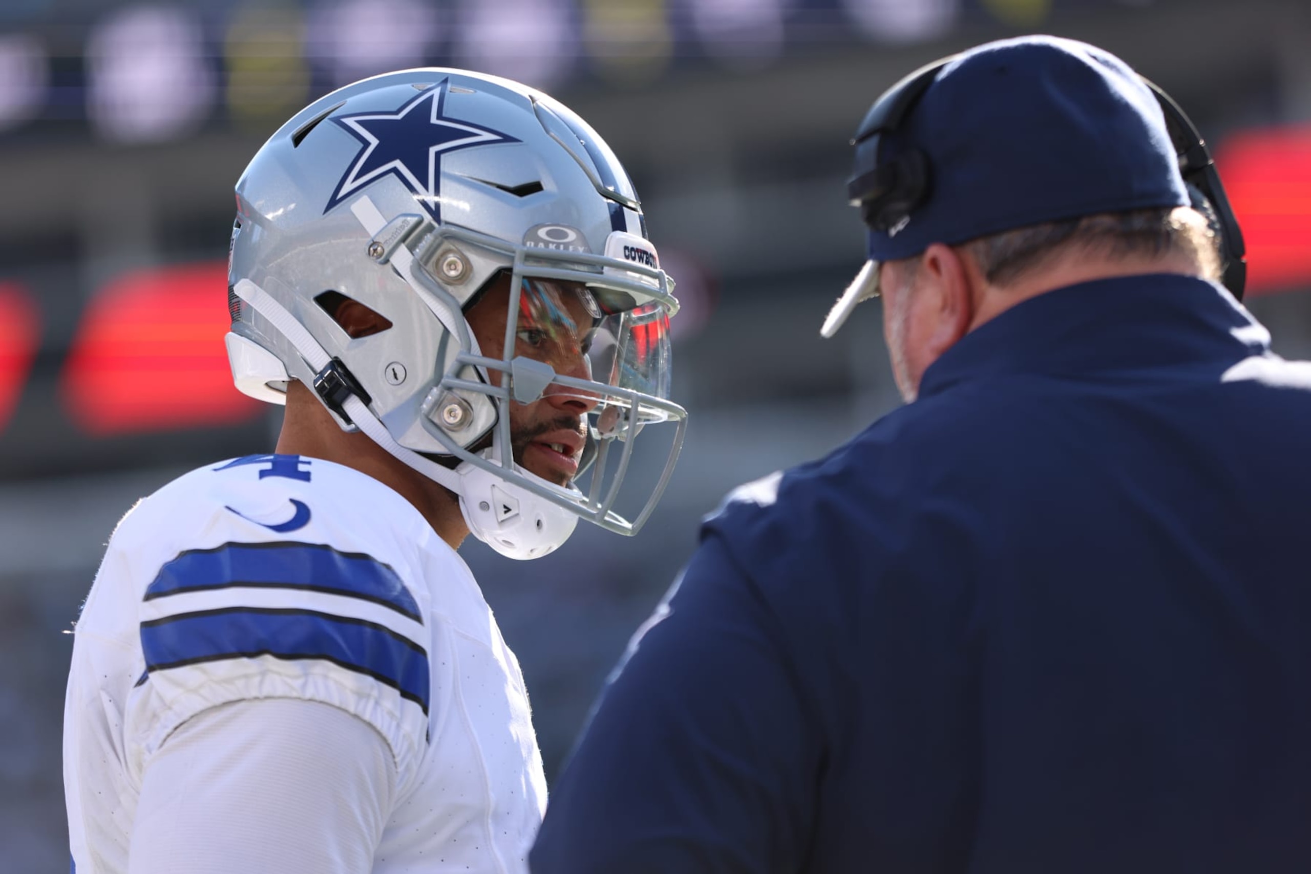 CHARLOTTE, NORTH CAROLINA - NOVEMBER 19: Dak Prescott #4 of the Dallas Cowboys speaks with head coach Mike McCarthy of the Dallas Cowboys in the game against the Carolina Panthers during the first quarter at Bank of America Stadium on November 19, 2023 in Charlotte, North Carolina. (Photo by David Jensen/Getty Images)