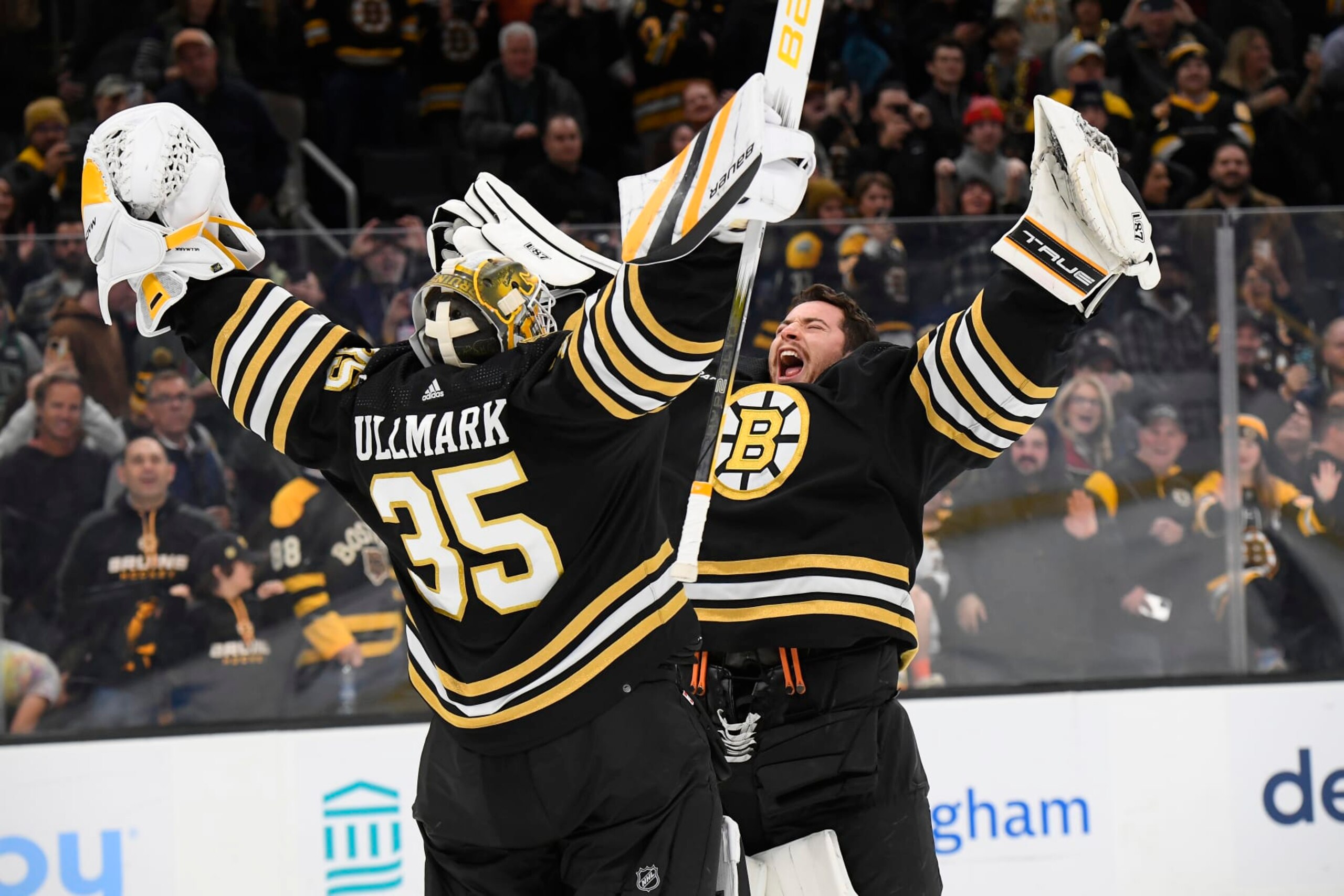 BOSTON, MA - NOVEMBER 9:  Linus Ullmark #35 and Jeremy Swayman #1 of the Boston Bruins celebrate their win against the New York Islanders at the TD Garden on November 9, 2023 in Boston, Massachusetts. (Photo by Brian Babineau/NHLI via Getty Images)
