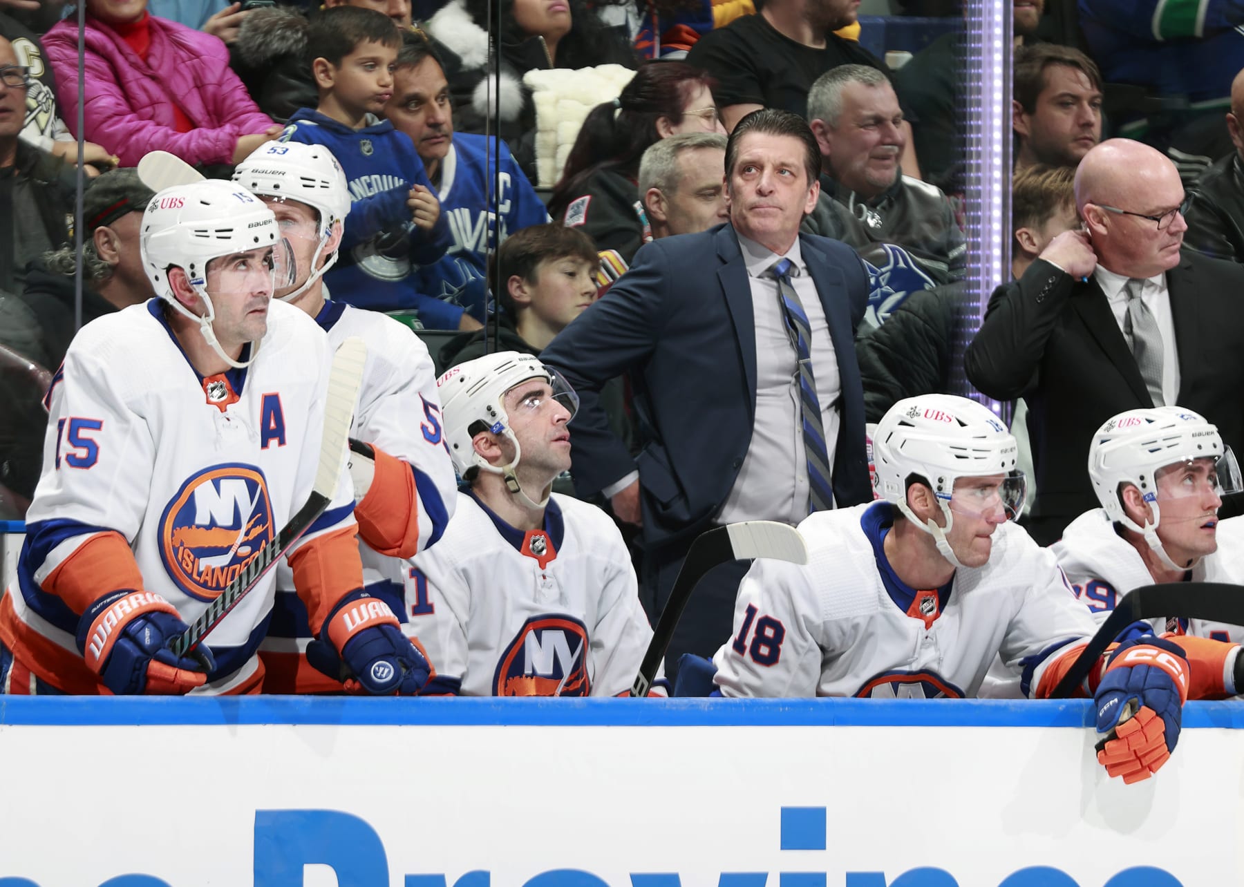 VANCOUVER, CANADA - NOVEMBER 15: Head coach Lane Lambert of the New York Islanders looks on from the bench during their NHL game against the Vancouver Canucks at Rogers Arena on November 15, 2023 in Vancouver, British Columbia, Canada.  (Photo by Jeff Vinnick/NHLI via Getty Images)