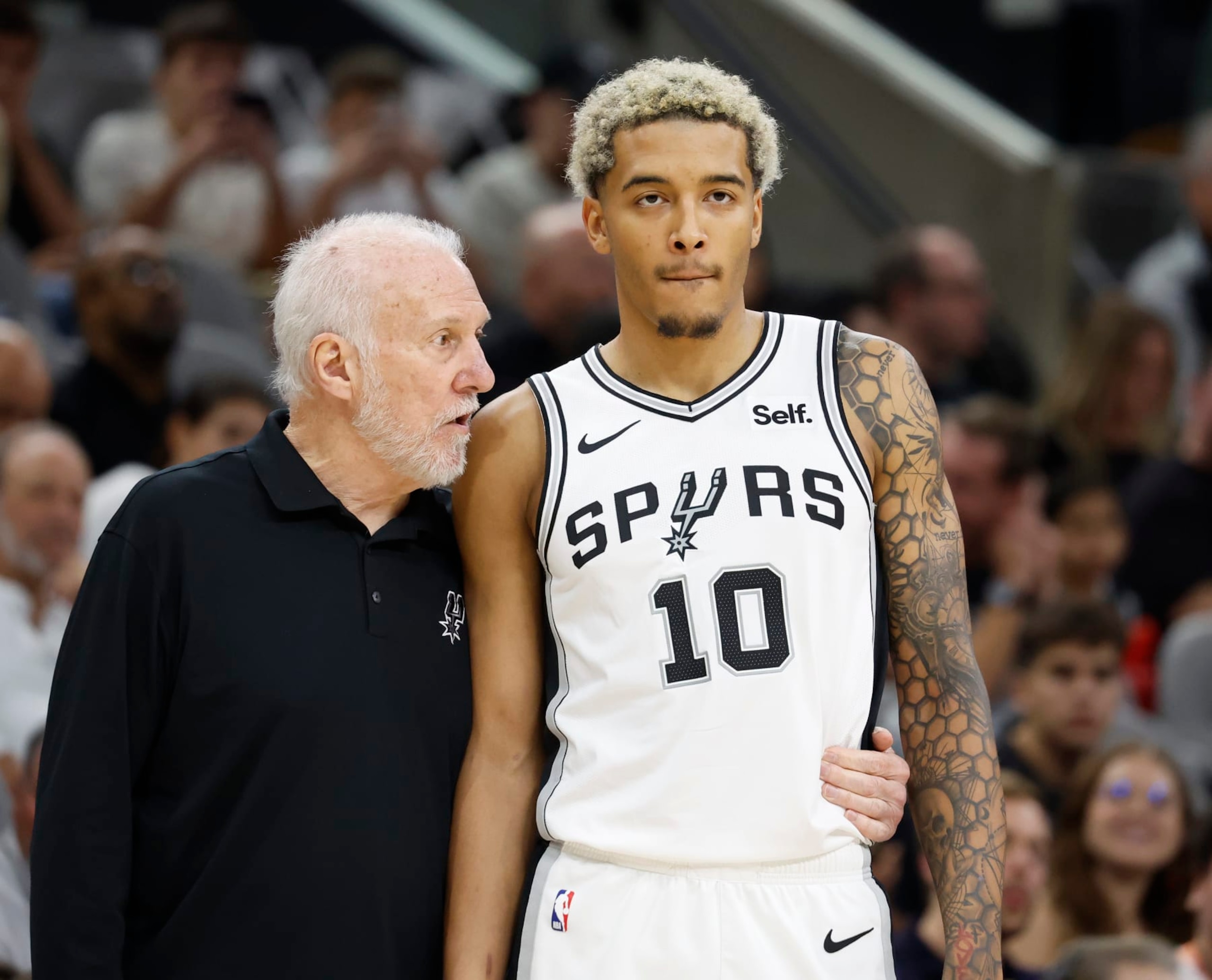 SAN ANTONIO, TX - NOVEMBER 18: Head coach Gregg Popovich of the San Antonio Spurs talks with Jeremy Sochan #10 during game against the Memphis Grizzlies in the second half at Frost Bank Center on November 18, 2023 in San Antonio, Texas. NOTE TO USER: User expressly acknowledges and agrees that, by downloading and or using this photograph, User is consenting to terms and conditions of the Getty Images License Agreement. (Photo by Ronald Cortes/Getty Images)