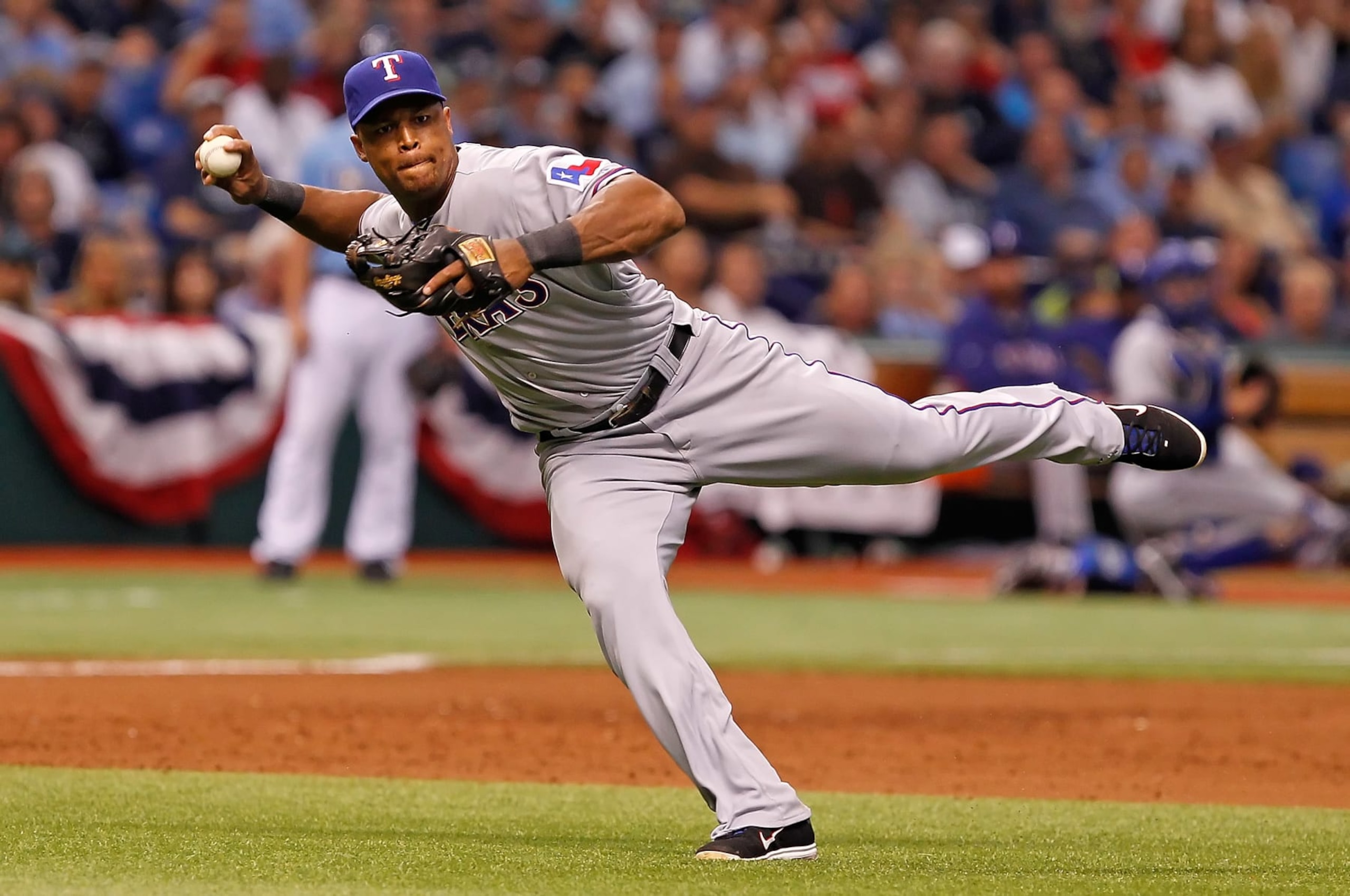 ST. PETERSBURG - OCTOBER 04:  Infielder Adrian Beltre #29 of the Texas Rangers throws over to first for an out against the Tampa Bay Rays during Game Four of the American League Division Series at Tropicana Field on October 4, 2011 in St. Petersburg, Florida.  (Photo by J. Meric/Getty Images)