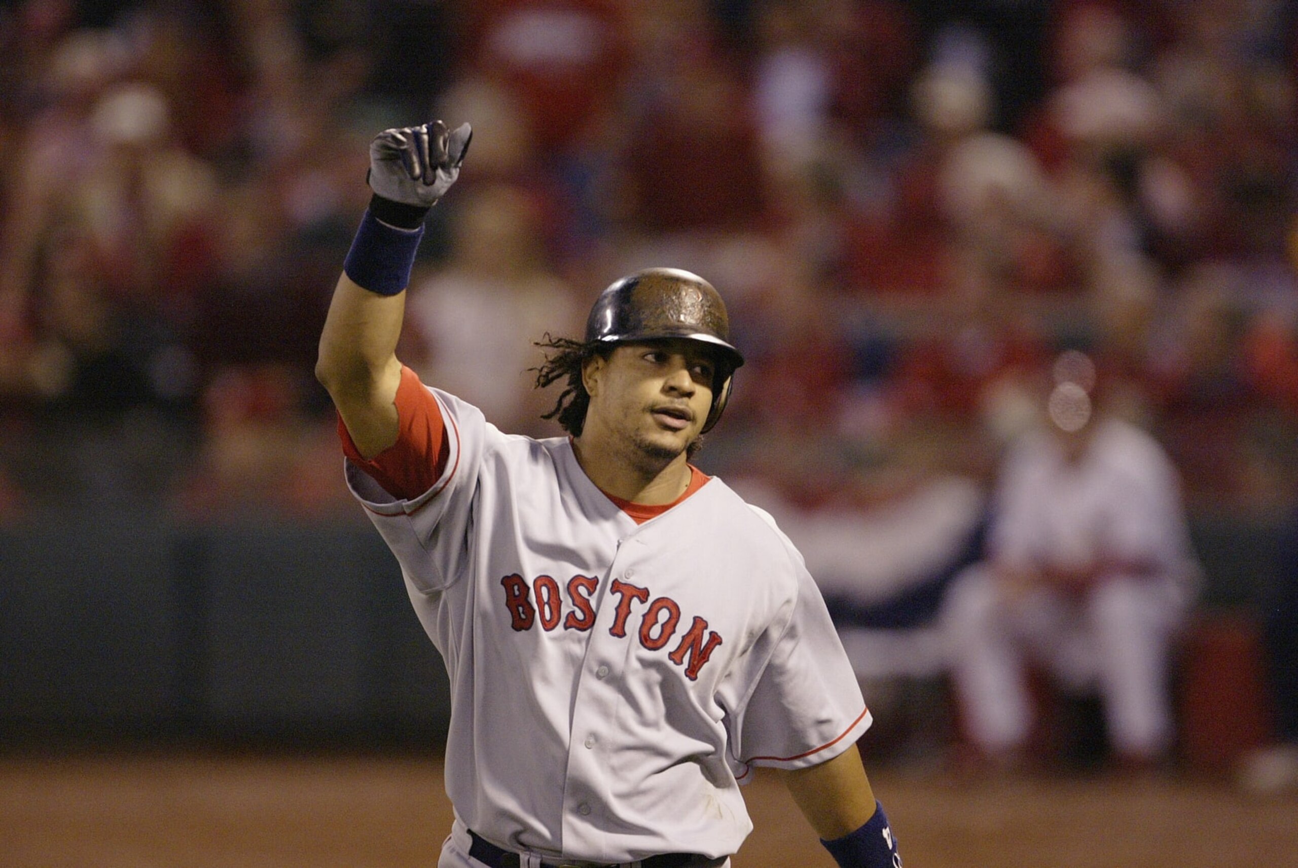 ST. LOUIS - OCTOBER 26:  Manny Ramirez of the Boston Red Sox celebrates after hitting a home run in the first inning during game three of the 2004 World Series against the St. Louis Cardinals at Busch Stadium on October 26, 2004 in St. Louis, Missouri. The Red Sox defeated the Cardinals 4-1. (Photo by Ron Vesely/MLB Photos via Getty Images)