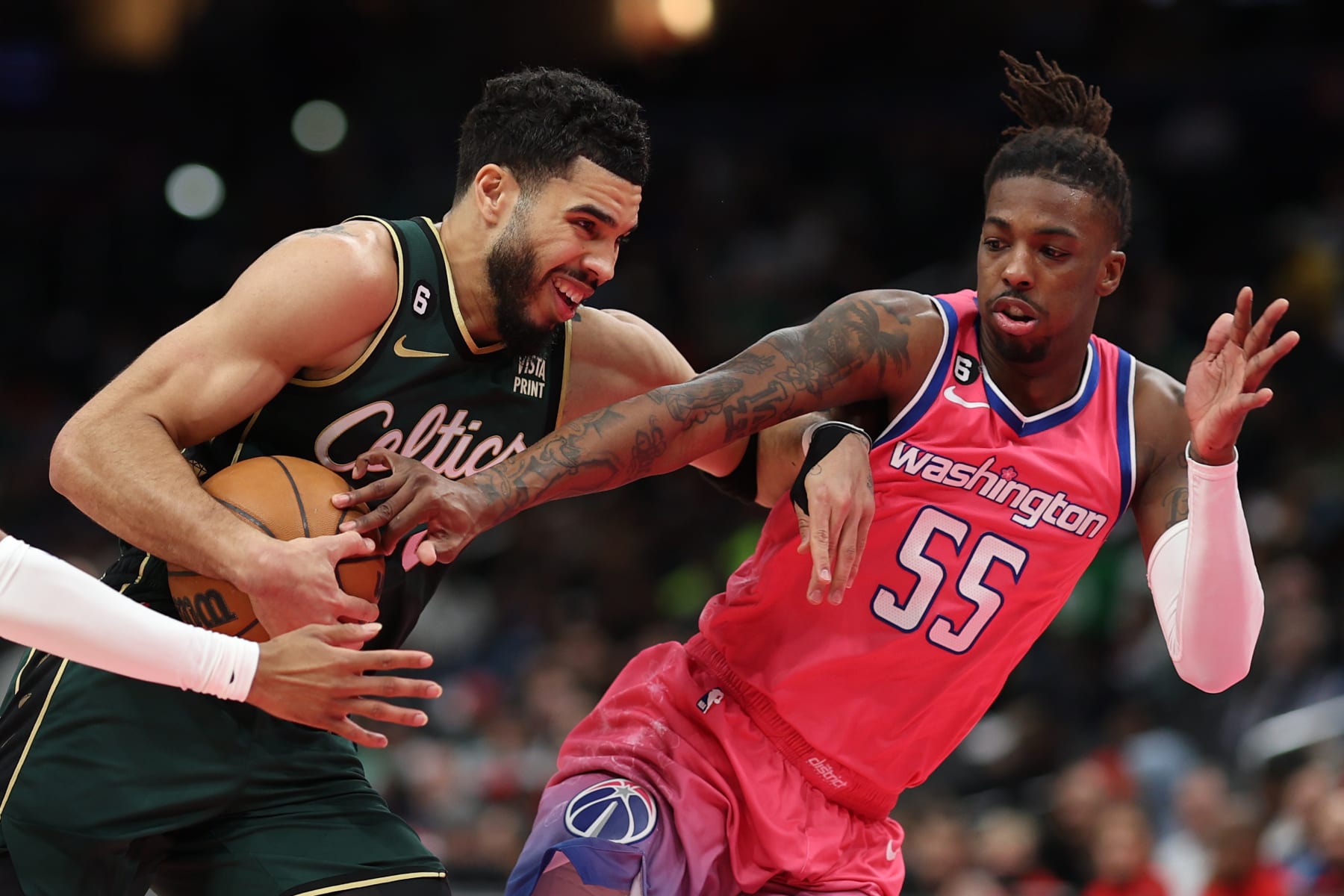 WASHINGTON, DC - MARCH 28: Jayson Tatum #0 of the Boston Celtics drives past Delon Wright #55 of the Washington Wizards during the first half at Capital One Arena on March 28, 2023 in Washington, DC. NOTE TO USER: User expressly acknowledges and agrees that, by downloading and or using this photograph, User is consenting to the terms and conditions of the Getty Images License Agreement. (Photo by Patrick Smith/Getty Images)
