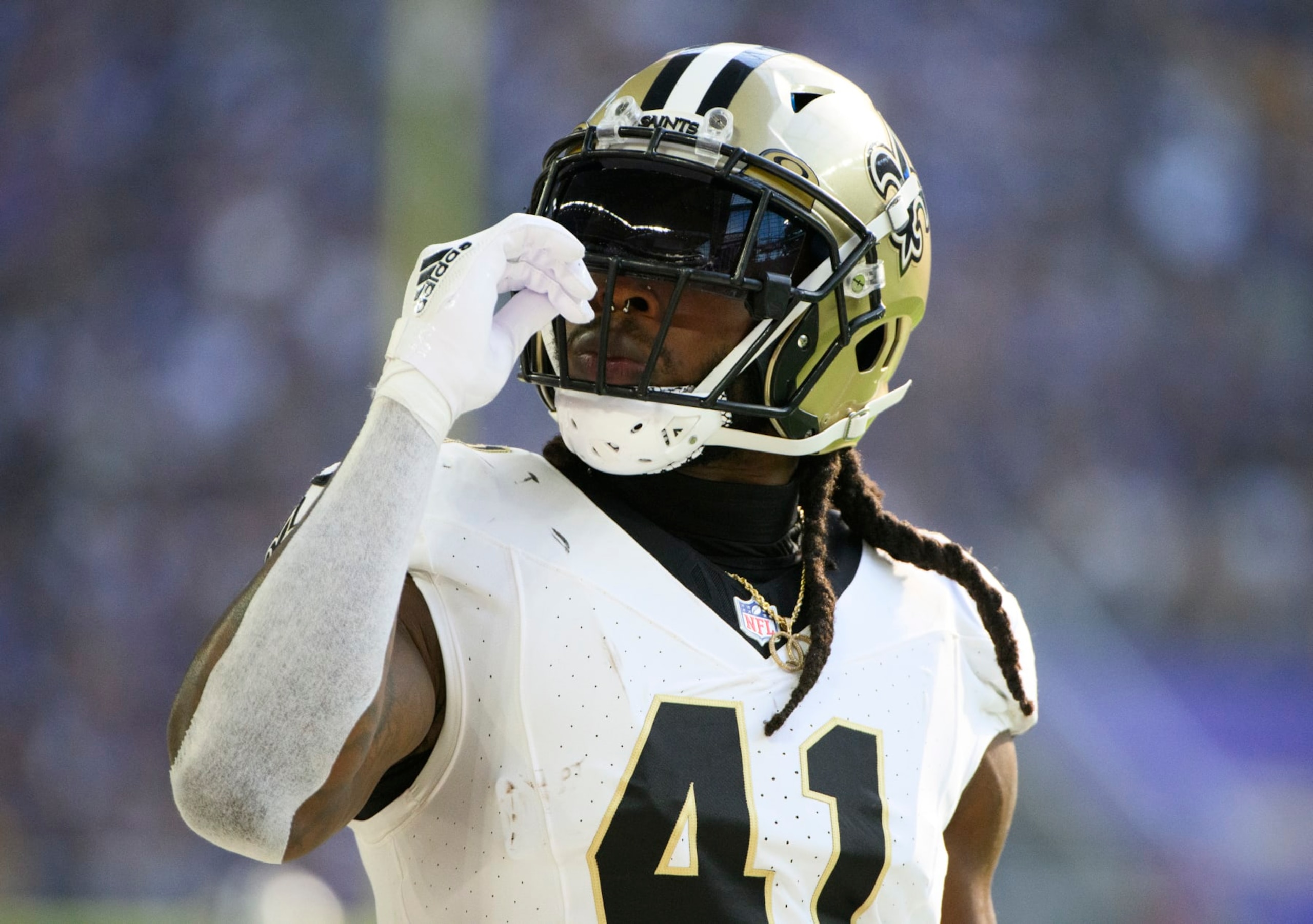 MINNEAPOLIS, MINNESOTA - NOVEMBER 12: Alvin Kamara #41 of the New Orleans Saints smells a smelling salts packet in the first quarter of the game against the Minnesota Vikings at U.S. Bank Stadium on November 12, 2023 in Minneapolis, Minnesota. (Photo by Stephen Maturen/Getty Images)