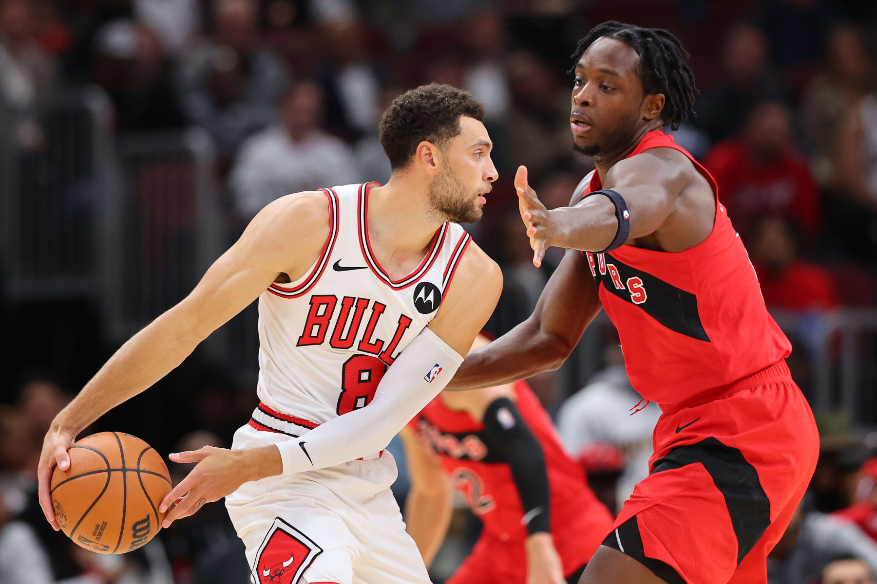 CHICAGO, ILLINOIS - OCTOBER 17: Zach LaVine #8 of the Chicago Bulls is defended by O.G. Anunoby #3 of the Toronto Raptors during the first half at the United Center on October 17, 2023 in Chicago, Illinois. NOTE TO USER: User expressly acknowledges and agrees that, by downloading and or using this photograph, User is consenting to the terms and conditions of the Getty Images License Agreement.  (Photo by Michael Reaves/Getty Images)