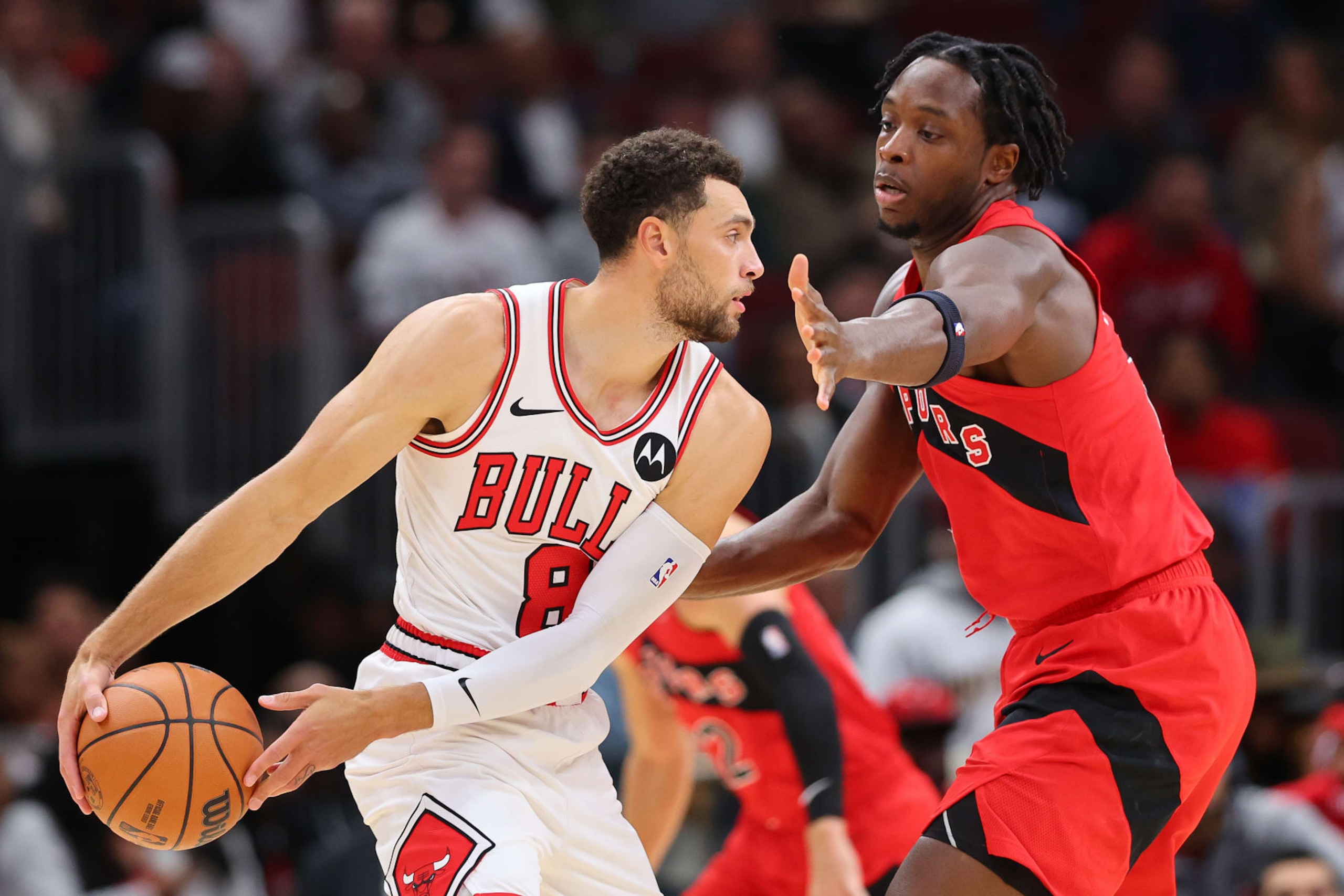 CHICAGO, ILLINOIS - OCTOBER 17: Zach LaVine #8 of the Chicago Bulls is defended by O.G. Anunoby #3 of the Toronto Raptors during the first half at the United Center on October 17, 2023 in Chicago, Illinois. NOTE TO USER: User expressly acknowledges and agrees that, by downloading and or using this photograph, User is consenting to the terms and conditions of the Getty Images License Agreement. (Photo by Michael Reaves/Getty Images) CHICAGO, ILLINOIS - OCTOBER 17: Zach LaVine #8 of the Chicago Bulls is defended by O.G. Anunoby #3 of the Toronto Raptors during the first half at the United Center on October 17, 2023 in Chicago, Illinois. NOTE TO USER: User expressly acknowledges and agrees that, by downloading and or using this photograph, User is consenting to the terms and conditions of the Getty Images License Agreement. (Photo by Michael Reaves/Getty Images)