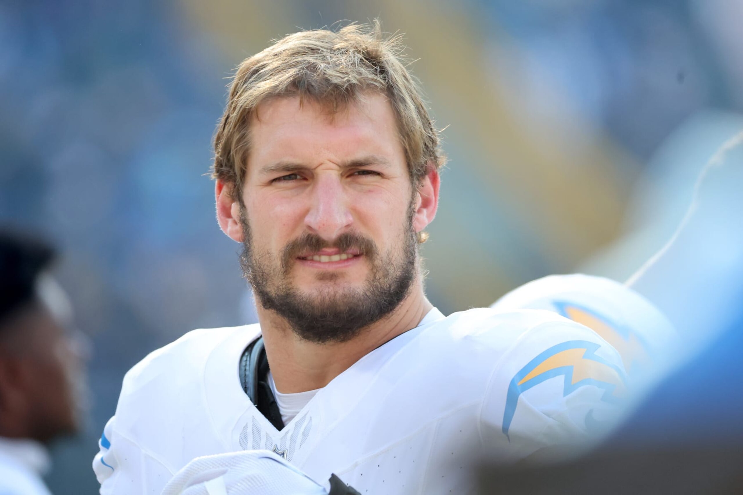 GREEN BAY, WISCONSIN - NOVEMBER 19: Joey Bosa #97 of the Los Angeles Chargers looks on from the bench before the game against the Green Bay Packers at Lambeau Field on November 19, 2023 in Green Bay, Wisconsin. (Photo by Stacy Revere/Getty Images)
