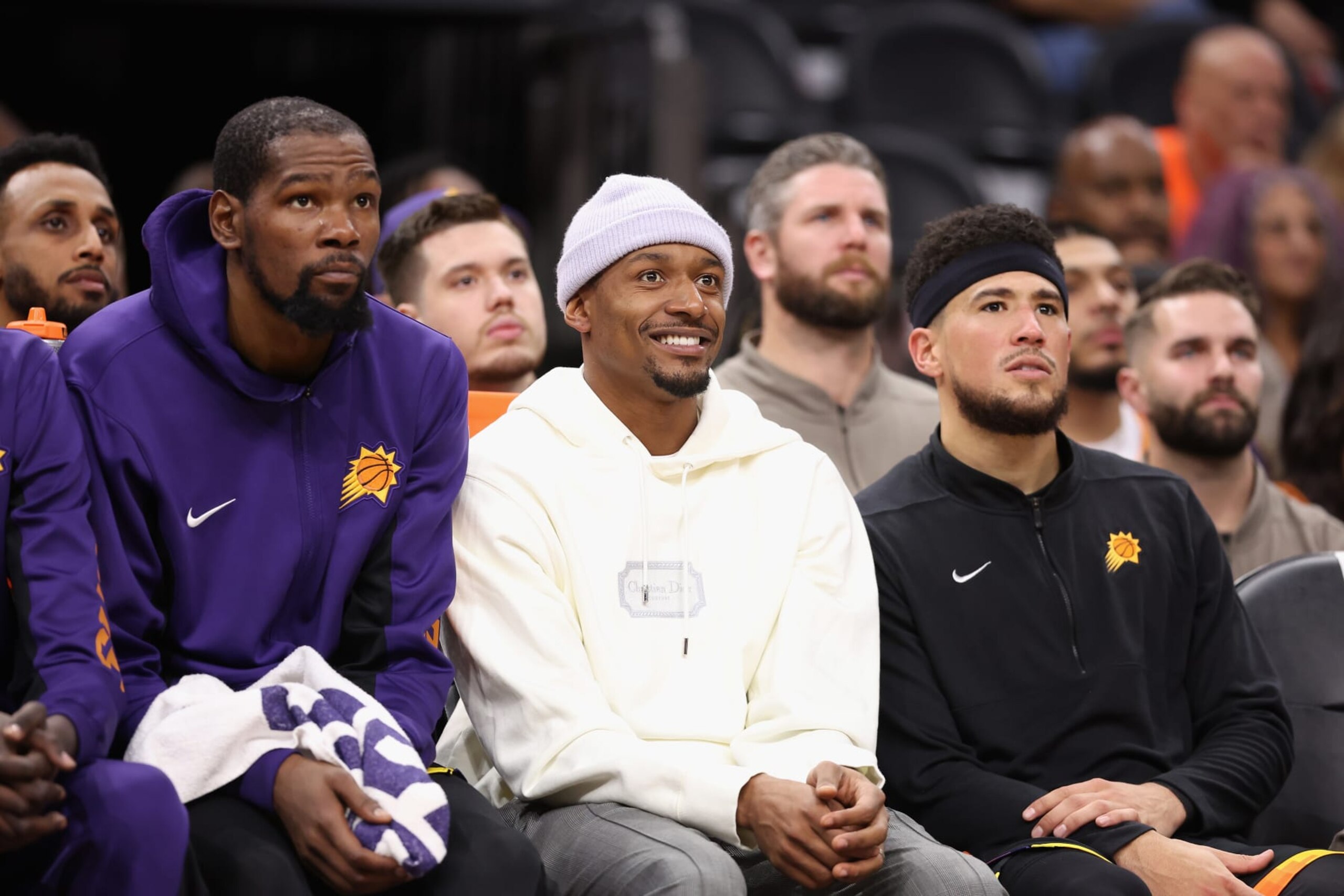 PHOENIX, ARIZONA - NOVEMBER 15: (L-R) Kevin Durant #35, Bradley Beal #3 and Devin Booker #1 of the Phoenix Suns watch from the bench during the second half of the NBA game against the Minnesota Timberwolves at Footprint Center on November 15, 2023 in Phoenix, Arizona. The Suns defeated the Timberwolves 133-115. NOTE TO USER: User expressly acknowledges and agrees that, by downloading and or using this photograph, User is consenting to the terms and conditions of the Getty Images License Agreement. (Photo by Christian Petersen/Getty Images) PHOENIX, ARIZONA - NOVEMBER 15: (L-R) Kevin Durant #35, Bradley Beal #3 and Devin Booker #1 of the Phoenix Suns watch from the bench during the second half of the NBA game against the Minnesota Timberwolves at Footprint Center on November 15, 2023 in Phoenix, Arizona. The Suns defeated the Timberwolves 133-115. NOTE TO USER: User expressly acknowledges and agrees that, by downloading and or using this photograph, User is consenting to the terms and conditions of the Getty Images License Agreement. (Photo by Christian Petersen/Getty Images)