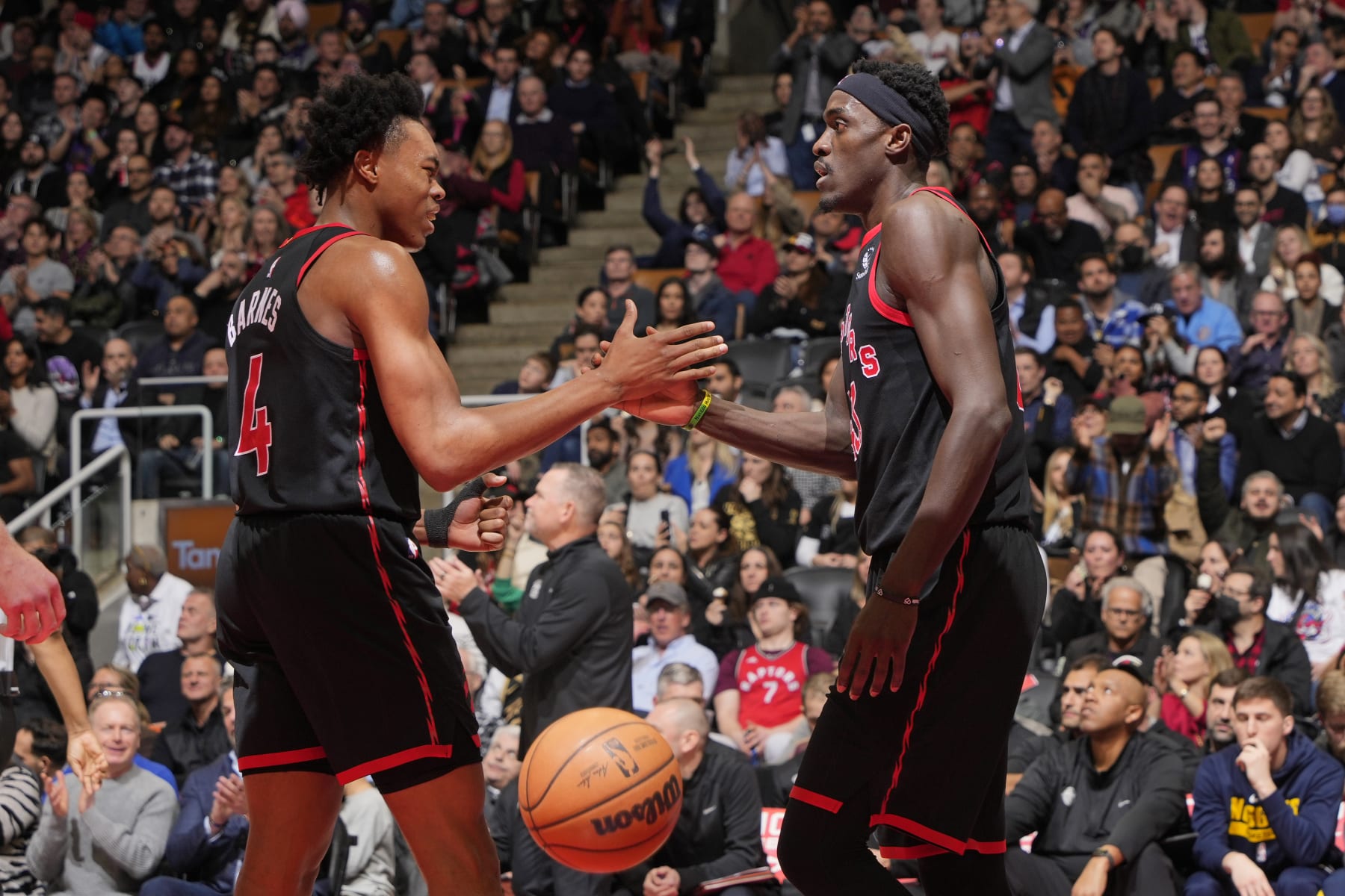 TORONTO, CANADA - MARCH 14: Scottie Barnes #4 and Pascal Siakam #43 of the Toronto Raptors shake hands against the Denver Nuggets on march 14, 2023 at the Scotiabank Arena in Toronto, Ontario, Canada. NOTE TO USER: User expressly acknowledges and agrees that, by downloading and or using this Photograph, user is consenting to the terms and conditions of the Getty Images License Agreement.  Mandatory Copyright Notice: Copyright 2023 NBAE (Photo by Mark Blinch/NBAE via Getty Images)