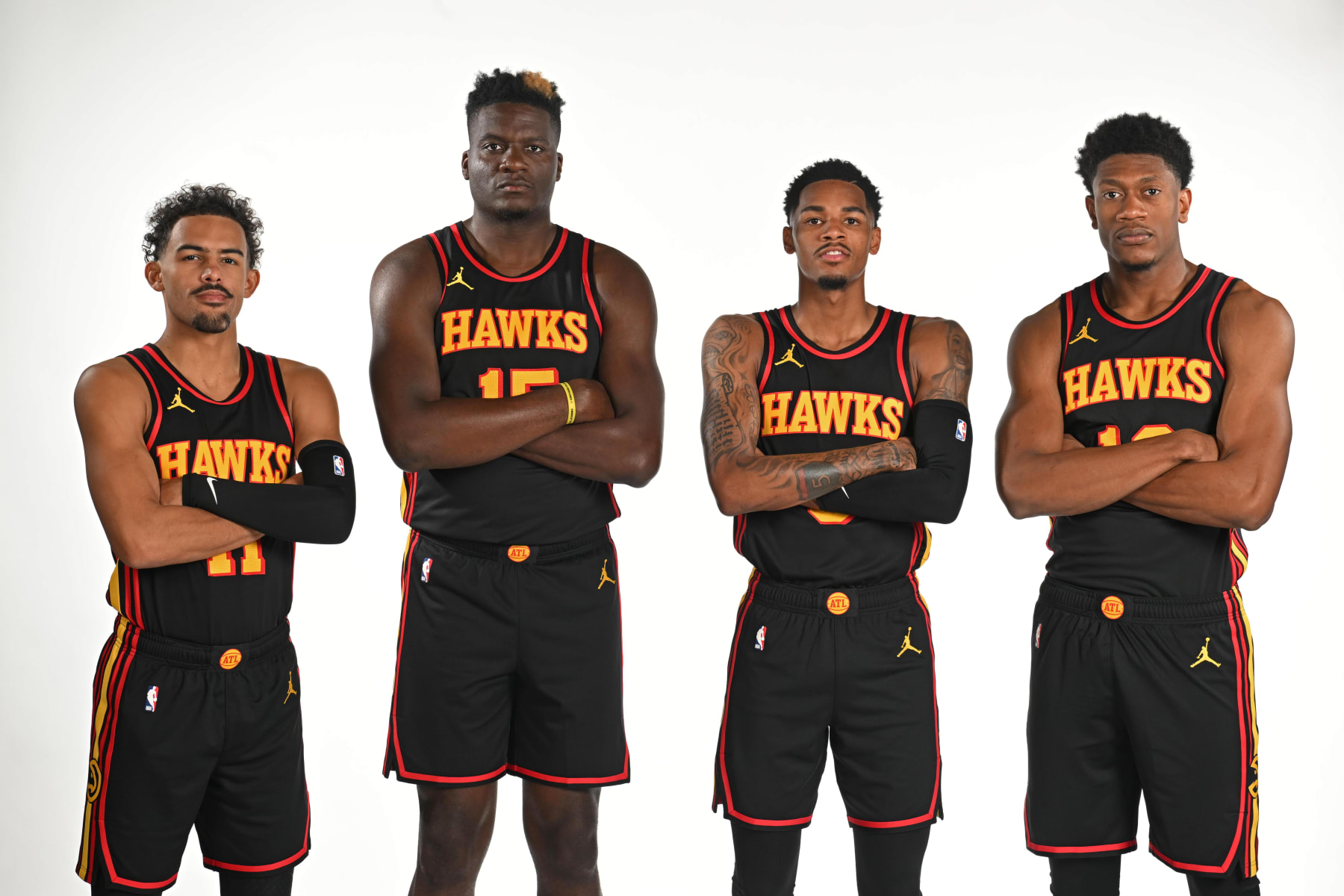 ATLANTA, GA - OCTOBER 2: Trae Young #11 Clint Capela #15 Dejounte Murray #5 and De'Andre Hunter #12 of the Atlanta Hawks poses for a portrait during 2023-24 NBA Media Day on October 2, 2023 at State Farm Arena in Atlanta, Georgia. NOTE TO USER: User expressly acknowledges and agrees that, by downloading and/or using this Photograph, user is consenting to the terms and conditions of the Getty Images License Agreement. Mandatory Copyright Notice: Copyright 2023 NBAE (Photo by Adam Hagy/NBAE via Getty Images)