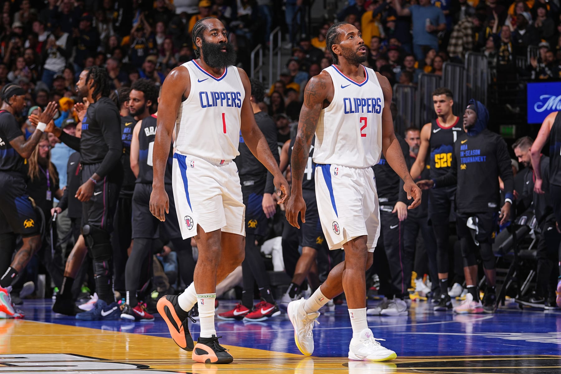 DENVER, CO - NOVEMBER 14: James Harden #1 and Kawhi Leonard #2 of the LA Clippers look on during the In-Season Tournament game against the Denver Nuggets on November 14, 2023 at the Ball Arena in Denver, Colorado. NOTE TO USER: User expressly acknowledges and agrees that, by downloading and/or using this Photograph, user is consenting to the terms and conditions of the Getty Images License Agreement. Mandatory Copyright Notice: Copyright 2023 NBAE (Photo by Bart Young/NBAE via Getty Images)