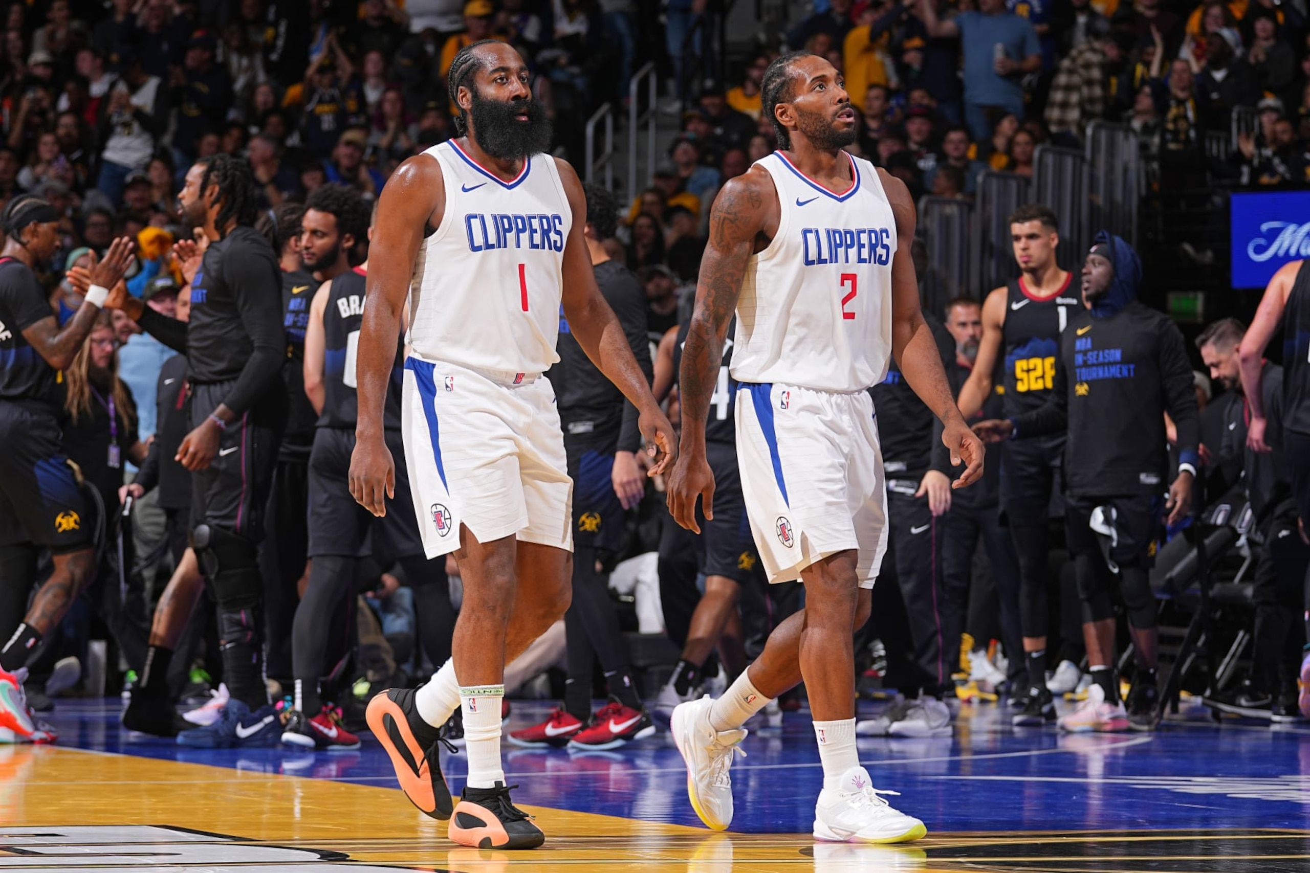 DENVER, CO - NOVEMBER 14: James Harden #1 and Kawhi Leonard #2 of the LA Clippers look on during the In-Season Tournament game against the Denver Nuggets on November 14, 2023 at the Ball Arena in Denver, Colorado. NOTE TO USER: User expressly acknowledges and agrees that, by downloading and/or using this Photograph, user is consenting to the terms and conditions of the Getty Images License Agreement. Mandatory Copyright Notice: Copyright 2023 NBAE (Photo by Bart Young/NBAE via Getty Images) DENVER, CO - NOVEMBER 14: James Harden #1 and Kawhi Leonard #2 of the LA Clippers look on during the In-Season Tournament game against the Denver Nuggets on November 14, 2023 at the Ball Arena in Denver, Colorado. NOTE TO USER: User expressly acknowledges and agrees that, by downloading and/or using this Photograph, user is consenting to the terms and conditions of the Getty Images License Agreement. Mandatory Copyright Notice: Copyright 2023 NBAE (Photo by Bart Young/NBAE via Getty Images)