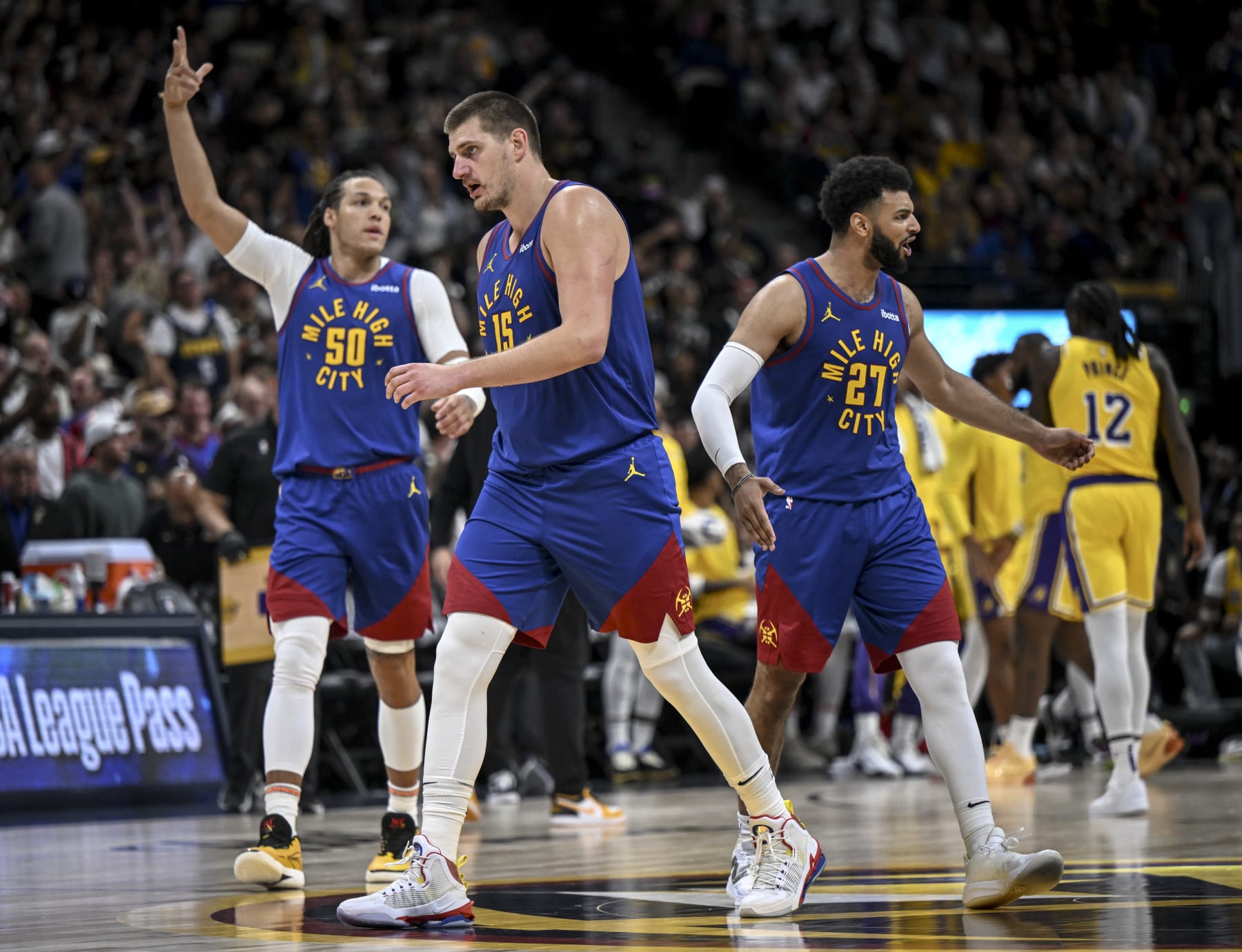 DENVER, CO - OCTOBER 24: Nikola Jokic (15) of the Denver Nuggets, Aaron Gordon (50) and Jamal Murray (27) walk to the bench for a timeout during the fourth quarter of the Nuggets' 119-107 win over the Los Angeles Lakers at Ball Arena in Denver on Tuesday, October 24, 2023. (Photo by AAron Ontiveroz/The Denver Post)