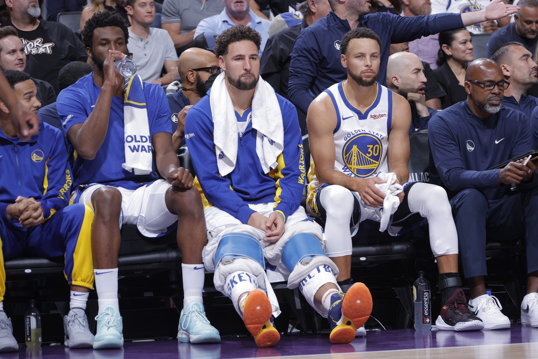 SACRAMENTO, CA - OCTOBER 27: Andrew Wiggins #22, Klay Thompson #11, and Stephen Curry #30 of the Golden State Warriors look on during the game against the Sacramento Kings on October 27, 2023 at Golden 1 Center in Sacramento, California. NOTE TO USER: User expressly acknowledges and agrees that, by downloading and or using this photograph, User is consenting to the terms and conditions of the Getty Images Agreement. Mandatory Copyright Notice: Copyright 2023 NBAE (Photo by Rocky Widner/NBAE via Getty Images)
