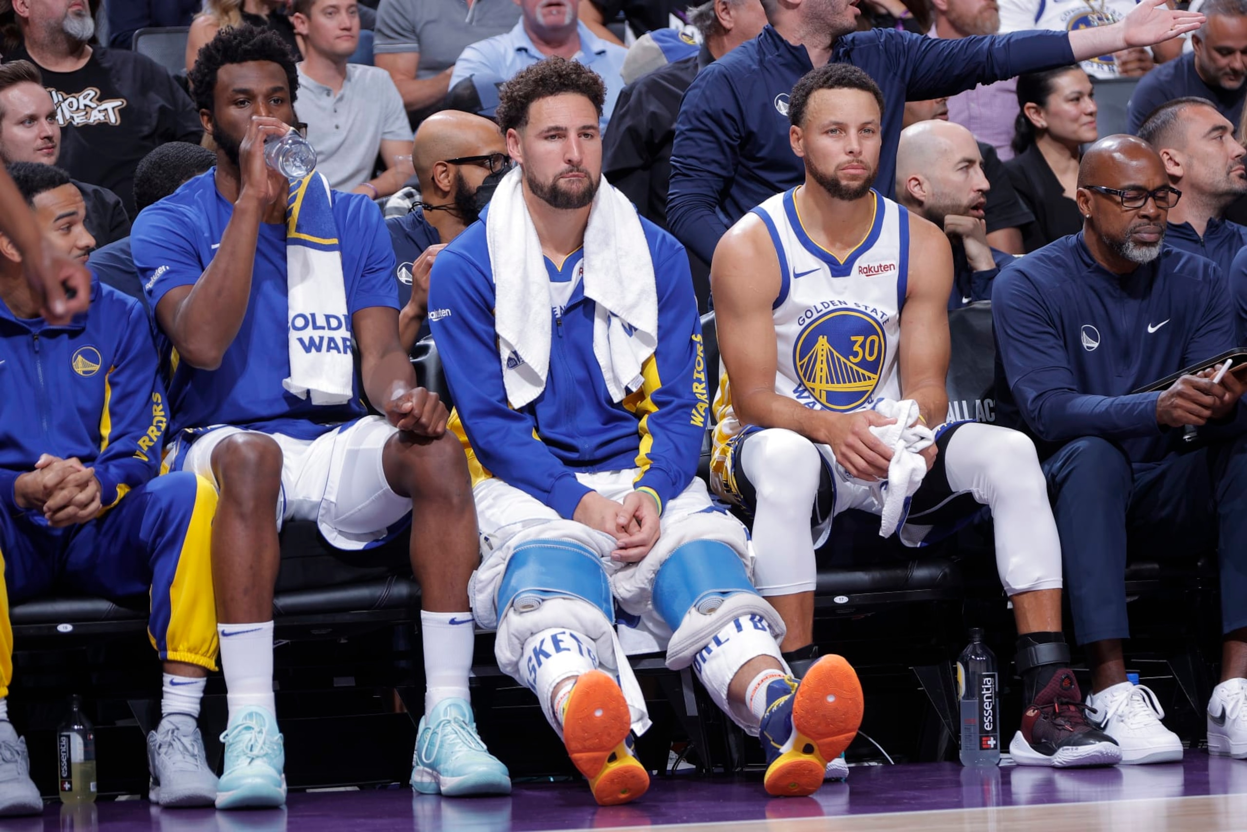 SACRAMENTO, CA - OCTOBER 27: Andrew Wiggins #22, Klay Thompson #11, and Stephen Curry #30 of the Golden State Warriors look on during the game against the Sacramento Kings on October 27, 2023 at Golden 1 Center in Sacramento, California. NOTE TO USER: User expressly acknowledges and agrees that, by downloading and or using this photograph, User is consenting to the terms and conditions of the Getty Images Agreement. Mandatory Copyright Notice: Copyright 2023 NBAE (Photo by Rocky Widner/NBAE via Getty Images) SACRAMENTO, CA - OCTOBER 27: Andrew Wiggins #22, Klay Thompson #11, and Stephen Curry #30 of the Golden State Warriors look on during the game against the Sacramento Kings on October 27, 2023 at Golden 1 Center in Sacramento, California. NOTE TO USER: User expressly acknowledges and agrees that, by downloading and or using this photograph, User is consenting to the terms and conditions of the Getty Images Agreement. Mandatory Copyright Notice: Copyright 2023 NBAE (Photo by Rocky Widner/NBAE via Getty Images)