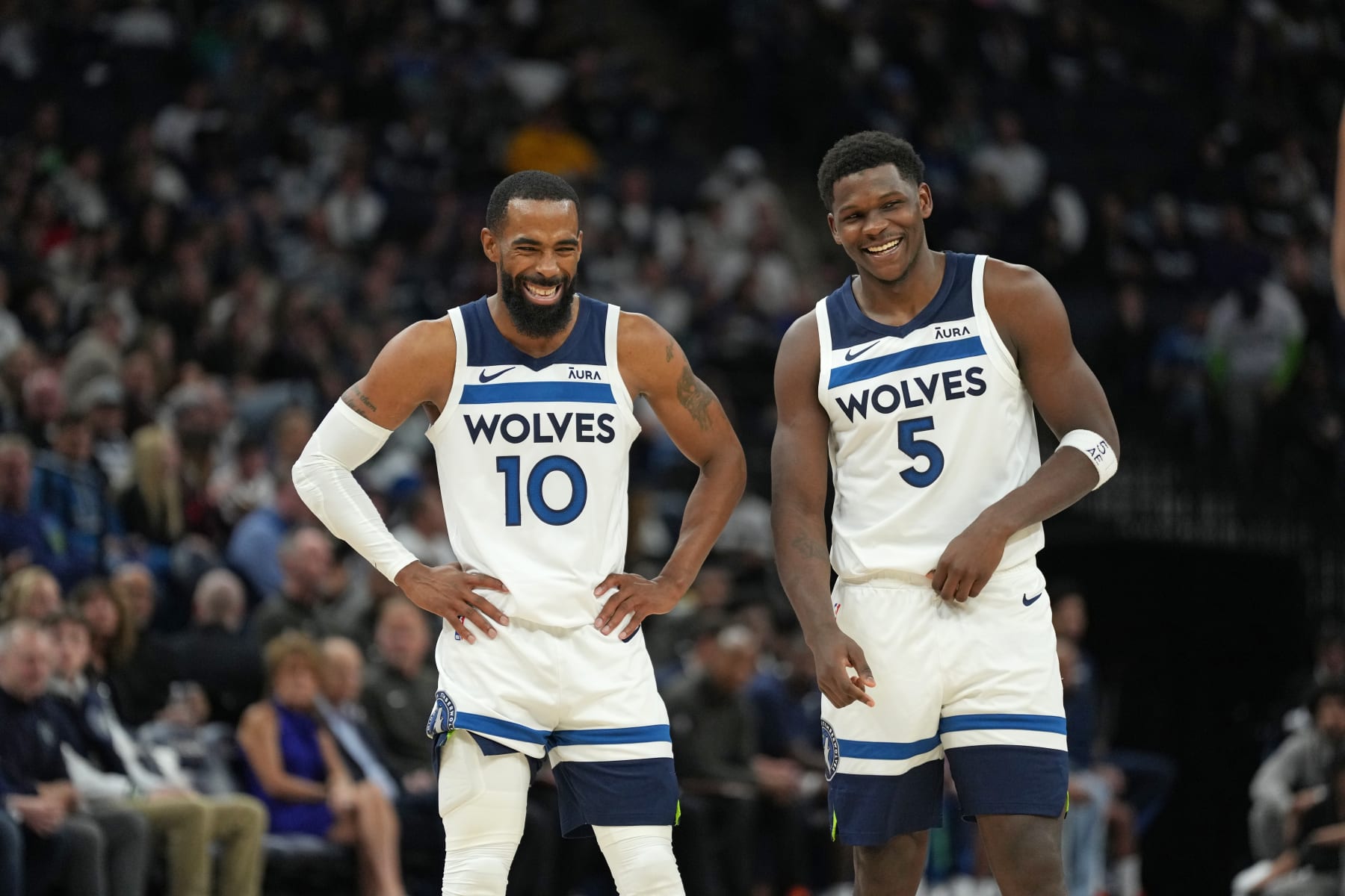 MINNEAPOLIS, MN -  OCTOBER 28: Mike Conley #10 of the Minnesota Timberwolves and Anthony Edwards #5 of the Minnesota Timberwolves smile during the game against the Miami Heat on October 28, 2023 at Target Center in Minneapolis, Minnesota. NOTE TO USER: User expressly acknowledges and agrees that, by downloading and or using this Photograph, user is consenting to the terms and conditions of the Getty Images License Agreement. Mandatory Copyright Notice: Copyright 2023 NBAE (Photo by Jordan Johnson/NBAE via Getty Images)