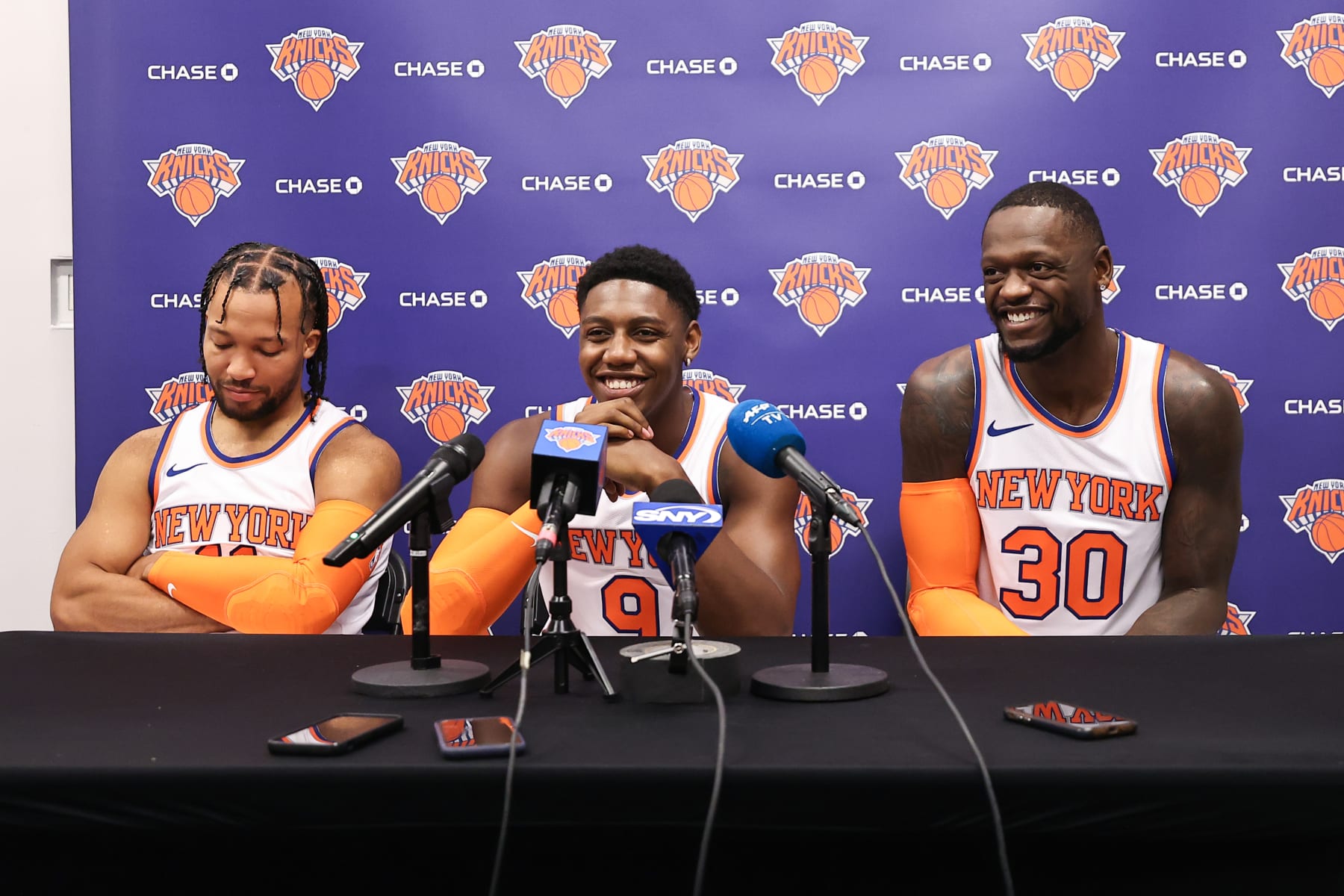 TARRYTOWN, NEW YORK - OCTOBER 02: Jalen Brunson #11, RJ Barrett #9, and Julius Randle #30 of the New York Knicks speak at a press conference during media day at the MSG Training Center on October 02, 2023 in Tarrytown, New York. NOTE TO USER: User expressly acknowledges and agrees that, by downloading and or using this photograph, User is consenting to the terms and conditions of the Getty Images License Agreement. (Photo by Dustin Satloff/Getty Images)