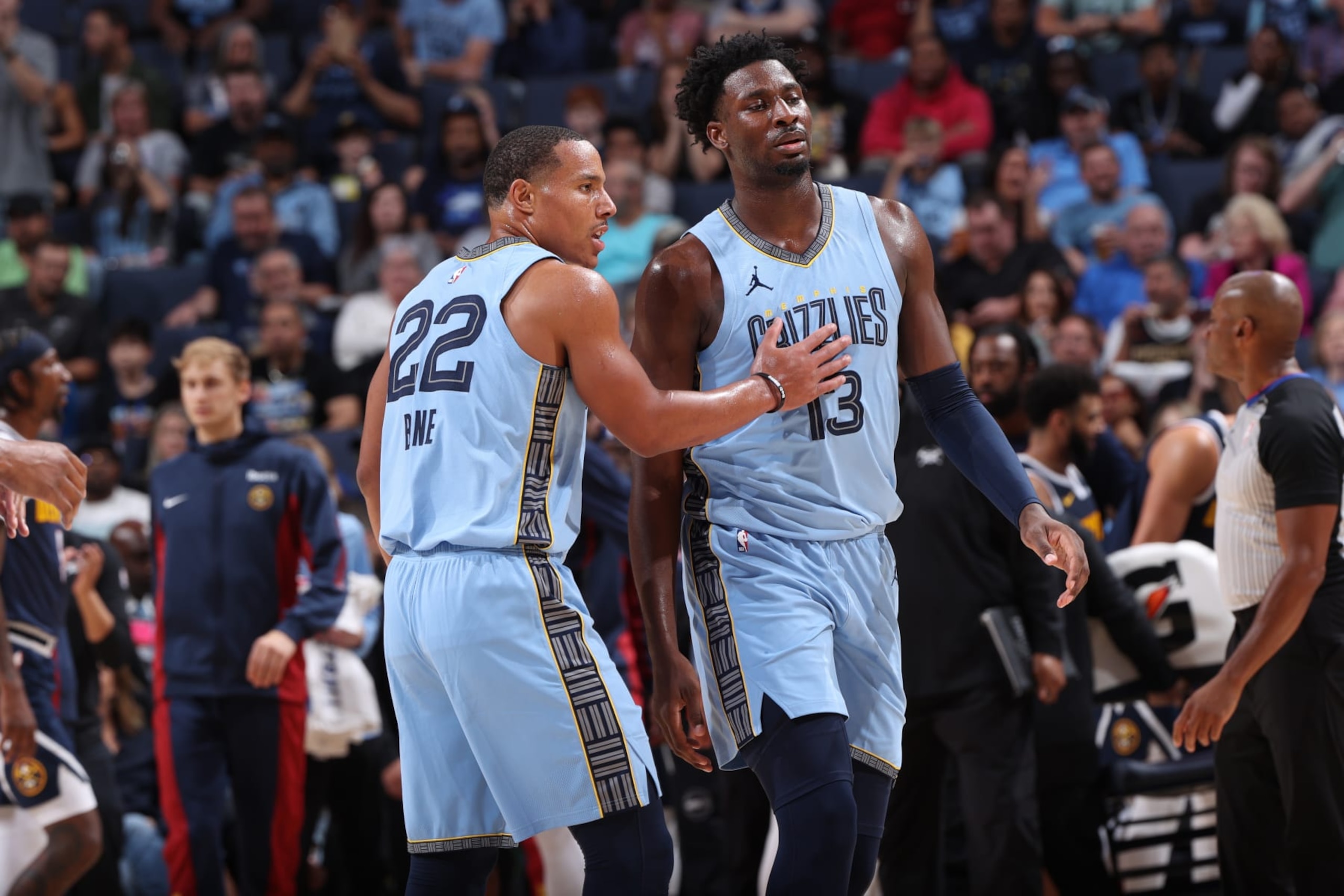 MEMPHIS, TN - OCTOBER 27: Desmond Bane #22 and Jaren Jackson Jr. #13 of the Memphis Grizzlies look on during the game against the Denver Nuggets on October 27, 2023 at FedExForum in Memphis, Tennessee. NOTE TO USER: User expressly acknowledges and agrees that, by downloading and or using this photograph, User is consenting to the terms and conditions of the Getty Images License Agreement. Mandatory Copyright Notice: Copyright 2023 NBAE (Photo by Joe Murphy/NBAE via Getty Images) MEMPHIS, TN - OCTOBER 27: Desmond Bane #22 and Jaren Jackson Jr. #13 of the Memphis Grizzlies look on during the game against the Denver Nuggets on October 27, 2023 at FedExForum in Memphis, Tennessee. NOTE TO USER: User expressly acknowledges and agrees that, by downloading and or using this photograph, User is consenting to the terms and conditions of the Getty Images License Agreement. Mandatory Copyright Notice: Copyright 2023 NBAE (Photo by Joe Murphy/NBAE via Getty Images)