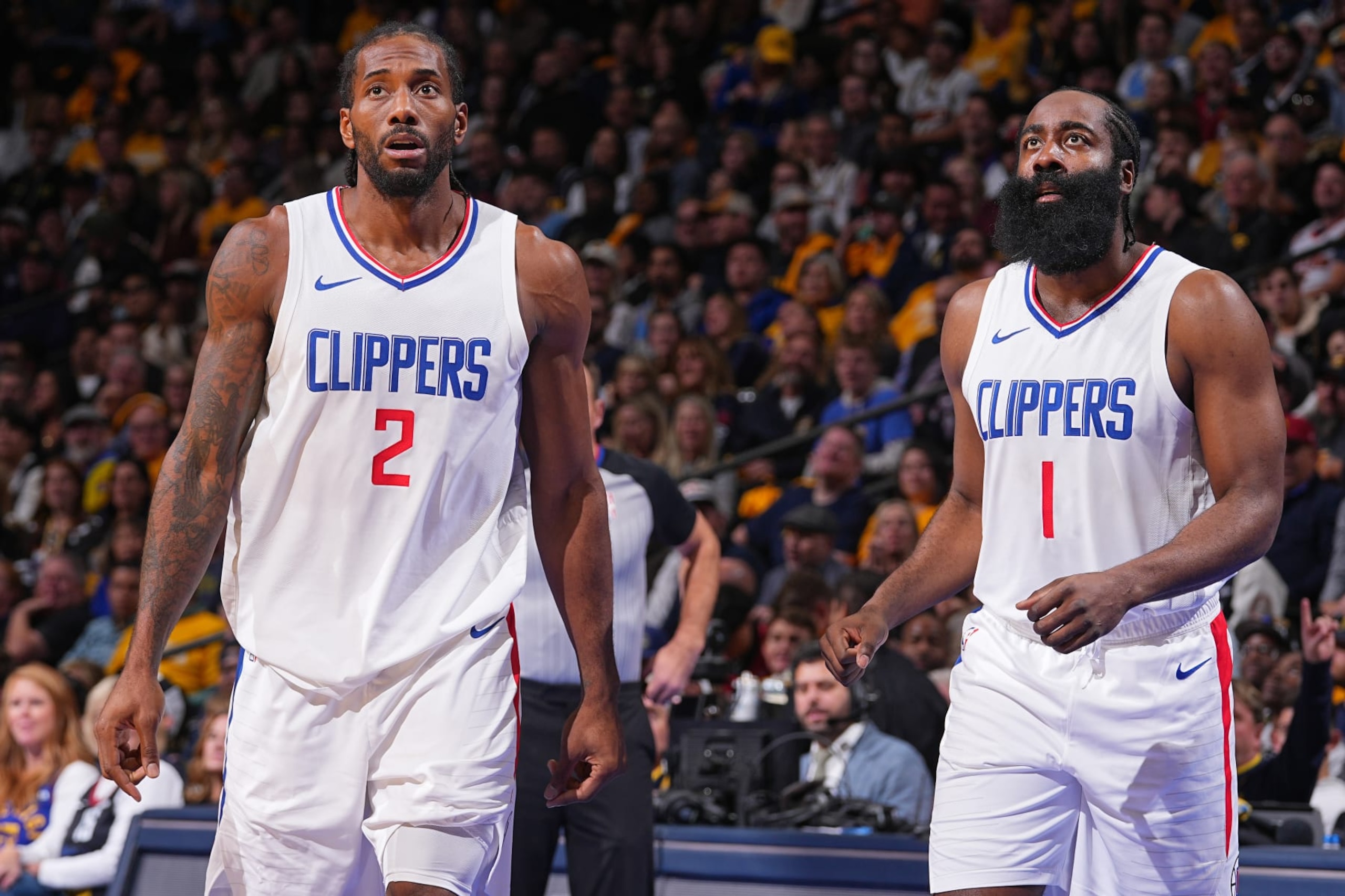 DENVER, CO - NOVEMBER 14: Kawhi Leonard #2 and James Harden #1 of the LA Clippers look on during the In-Season Tournament game against the Denver Nuggets on November 14, 2023 at the Ball Arena in Denver, Colorado. NOTE TO USER: User expressly acknowledges and agrees that, by downloading and/or using this Photograph, user is consenting to the terms and conditions of the Getty Images License Agreement. Mandatory Copyright Notice: Copyright 2023 NBAE (Photo by Bart Young/NBAE via Getty Images) DENVER, CO - NOVEMBER 14: Kawhi Leonard #2 and James Harden #1 of the LA Clippers look on during the In-Season Tournament game against the Denver Nuggets on November 14, 2023 at the Ball Arena in Denver, Colorado. NOTE TO USER: User expressly acknowledges and agrees that, by downloading and/or using this Photograph, user is consenting to the terms and conditions of the Getty Images License Agreement. Mandatory Copyright Notice: Copyright 2023 NBAE (Photo by Bart Young/NBAE via Getty Images)